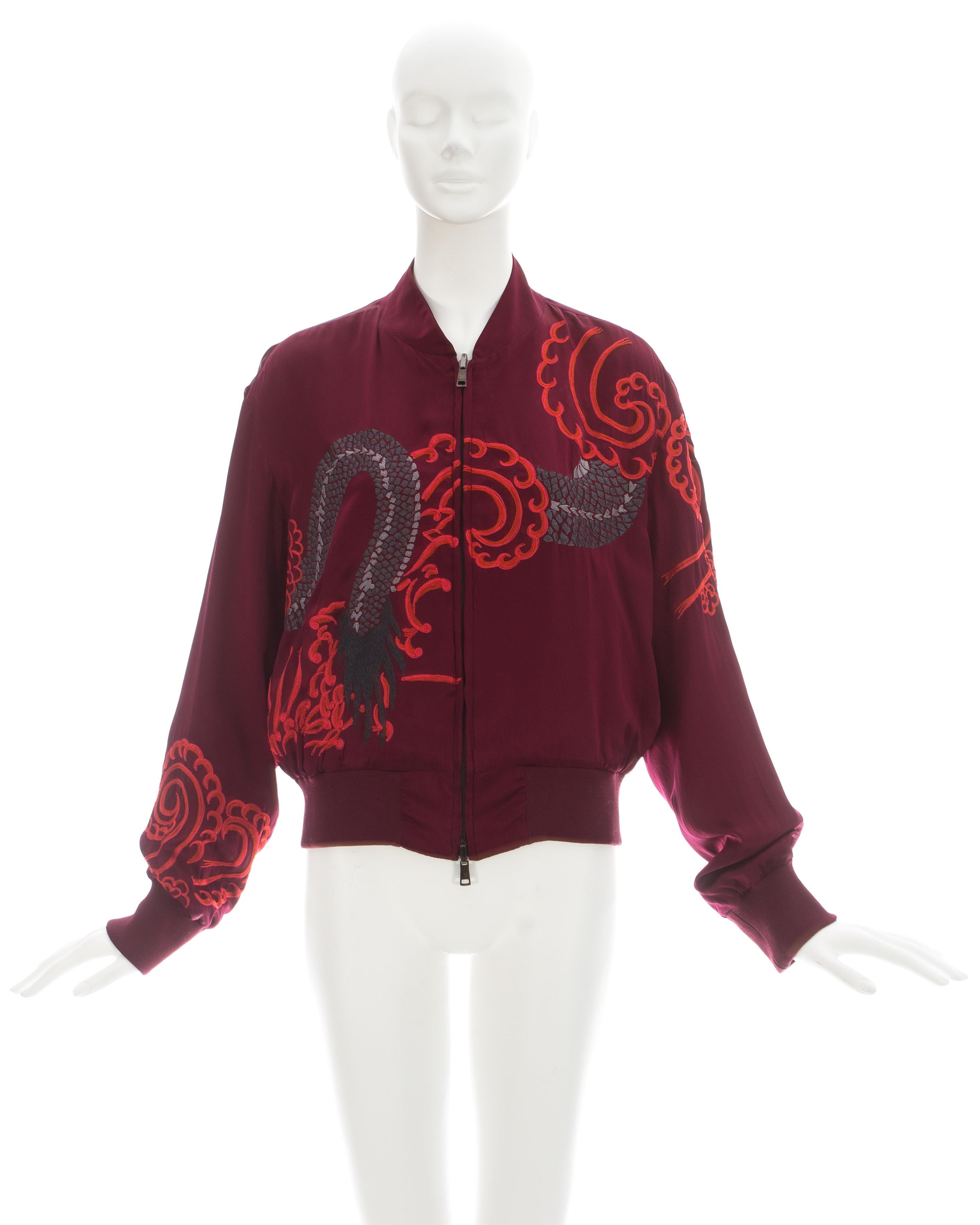 Gucci by Tom Ford; Red silk reversible bomber jacket; one side with dragon embroidery and the other plain.

Spring-Summer 2001