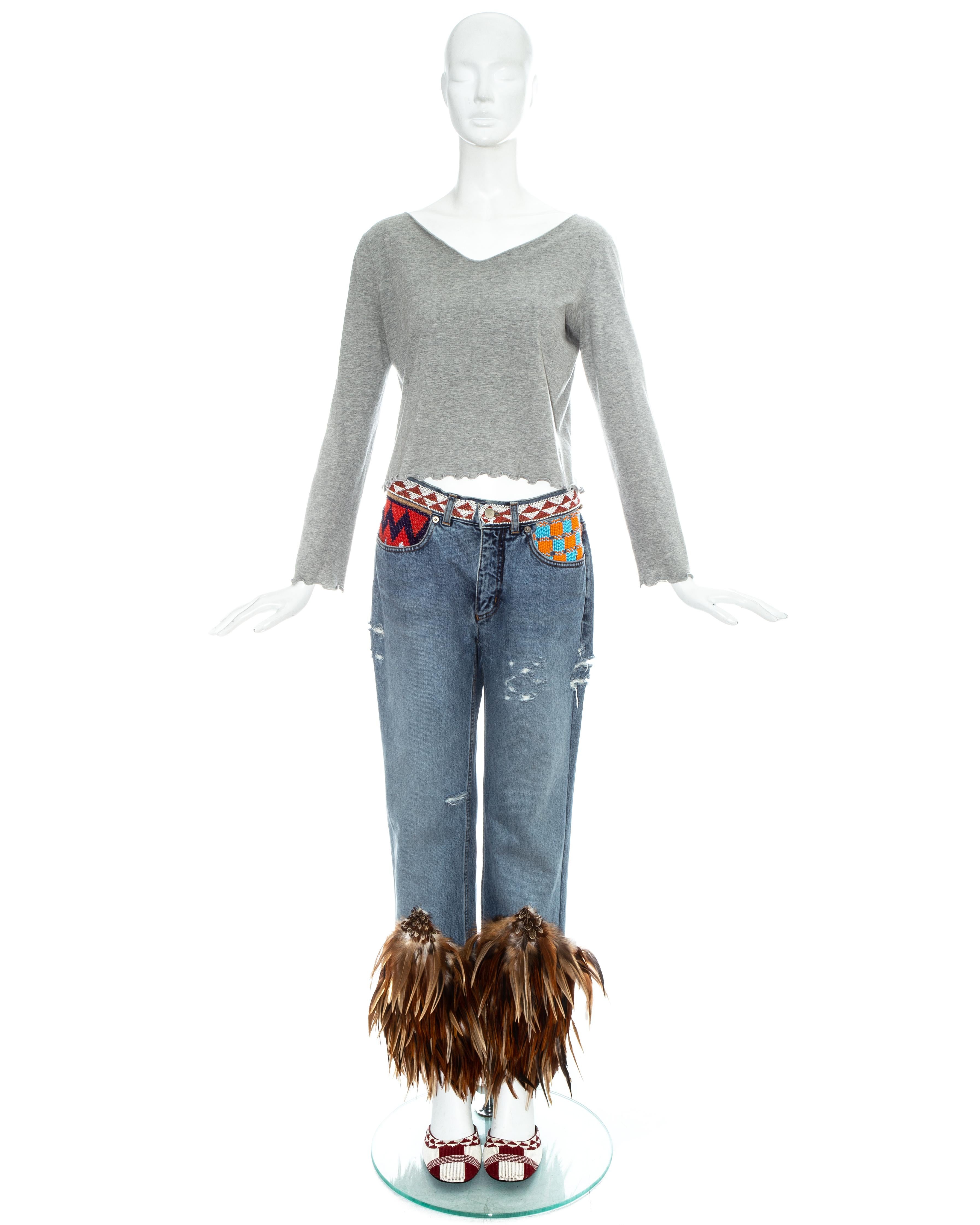Gucci by Tom Ford iconic runway ensemble. Grey cotton jersey sweater with ruffled trim, beaded and feathered denim jeans, and red and white beaded sandals. 

Spring-Summer 1999

Top - IT 44 - FR 40 - UK 12 - US 8
Pants - IT 44 - FR 40 - UK 12 - US