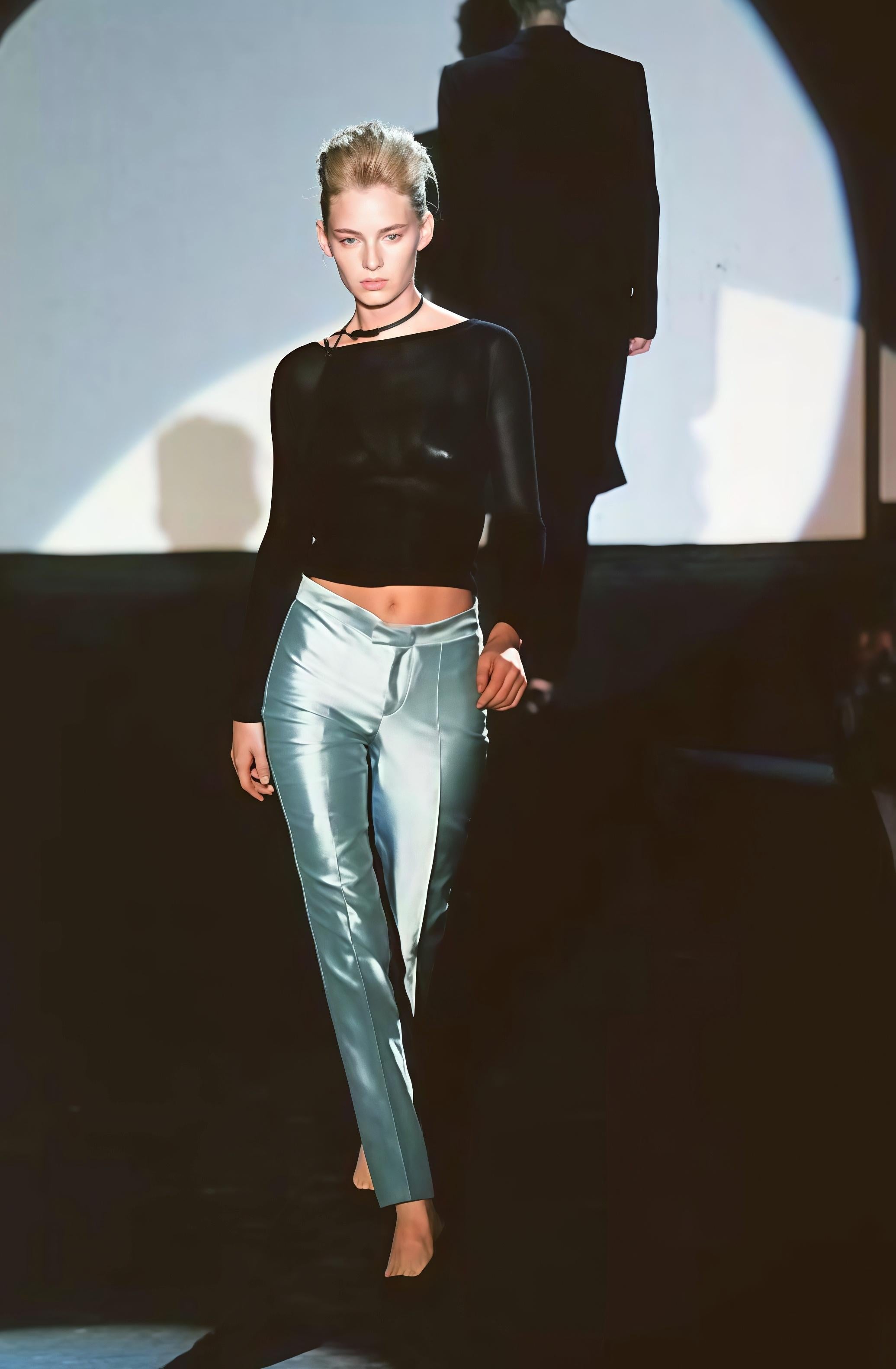 These light blue tailored pants offer a sleek and sophisticated look, perfect for both formal and semi-formal occasions. Featuring a high-waisted fit and straight-leg silhouette. Also features a high-waist fit and minimal detailing of crytal G