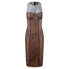 GUCCI by Tom Ford for Gucci, abito da passerella con corsetto in rete per la P/E 2001.