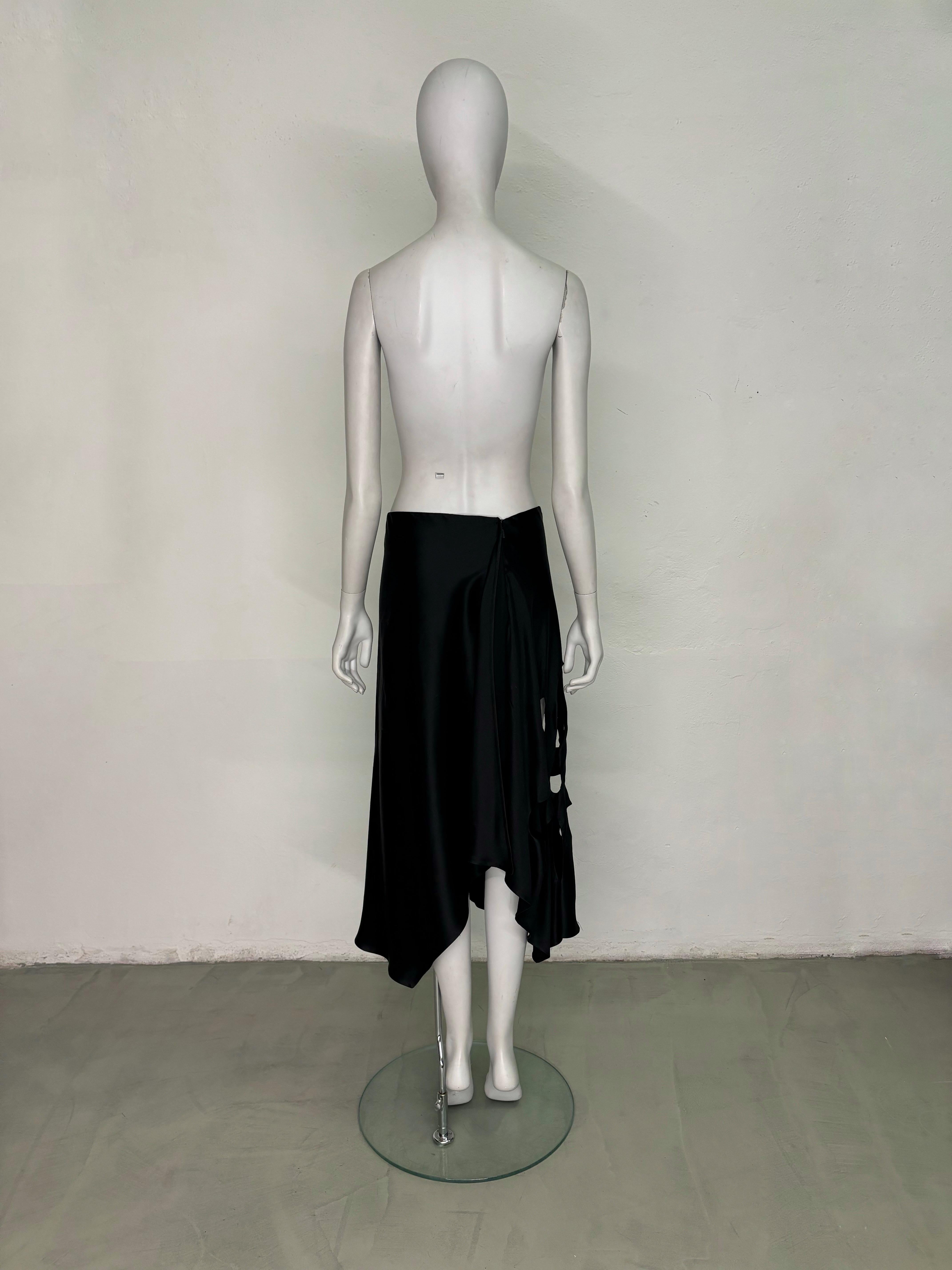 - Gucci by Tom Ford
- Sold by Gold Palms Vintage
- ⁠Spring Summer 2002 collection
- ⁠Black silk midi length skirt
- ⁠Bias-Cut
- ⁠Cut out floral side motif
- ⁠Side zipper 
- Minor pilling not noticeable when worn
- ⁠Size tag removed (fits IT