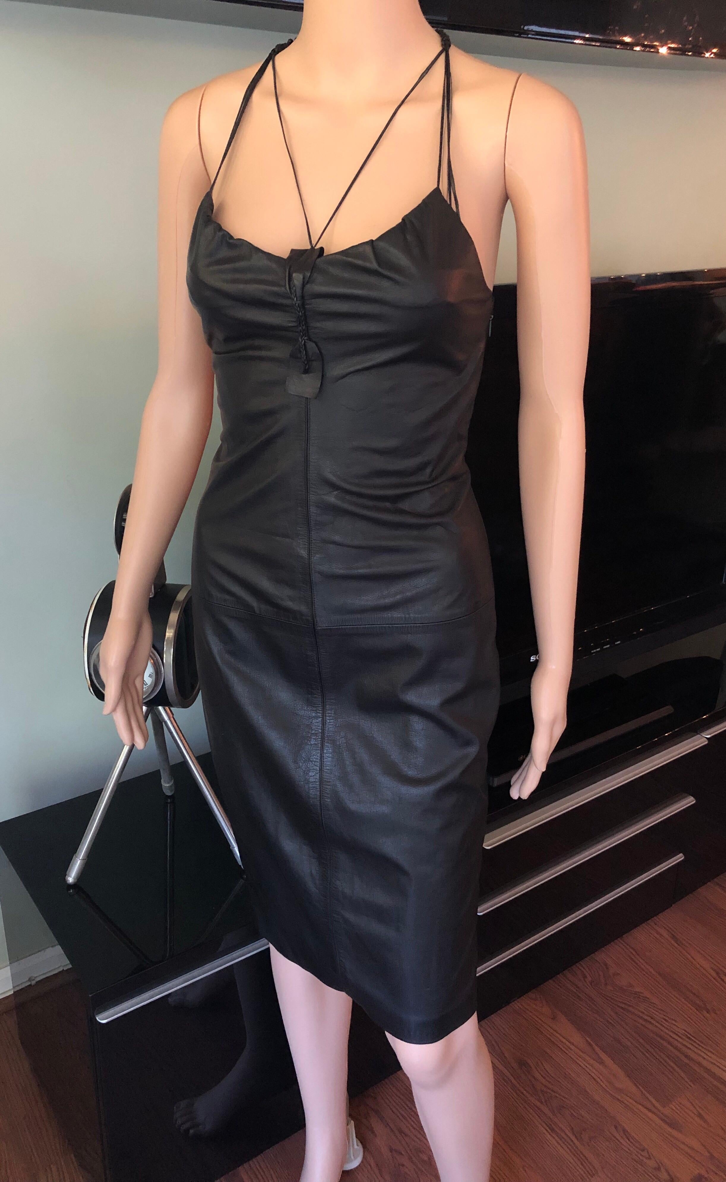 Gucci by Tom Ford S/S 2002 Leather Bustier Dress IT 38

Black Gucci leather sleeveless dress featuring V-neck, low back, slit at hem and concealed zip closure at side.
