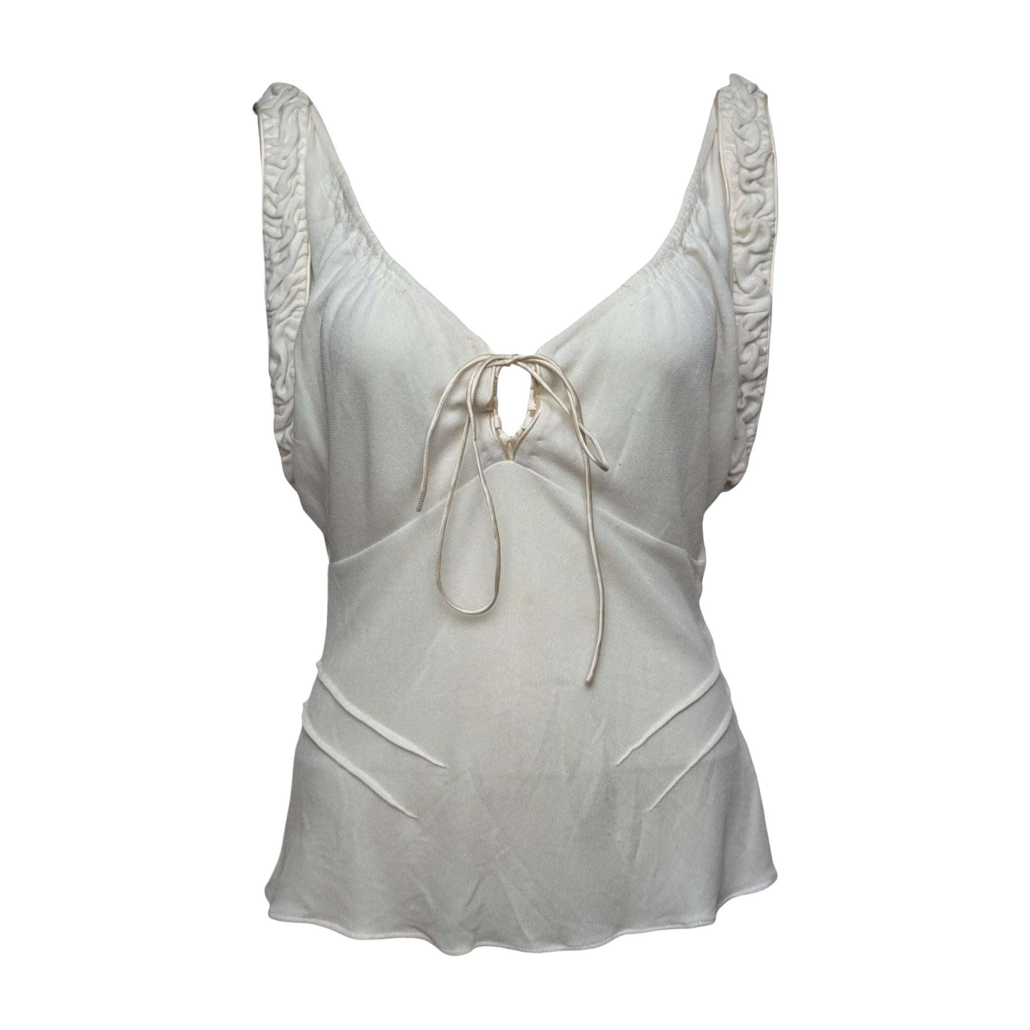 Gucci par Tom Ford, collection printemps-été 2003 : haut ivoire à bretelles froncées et noué sur le devant