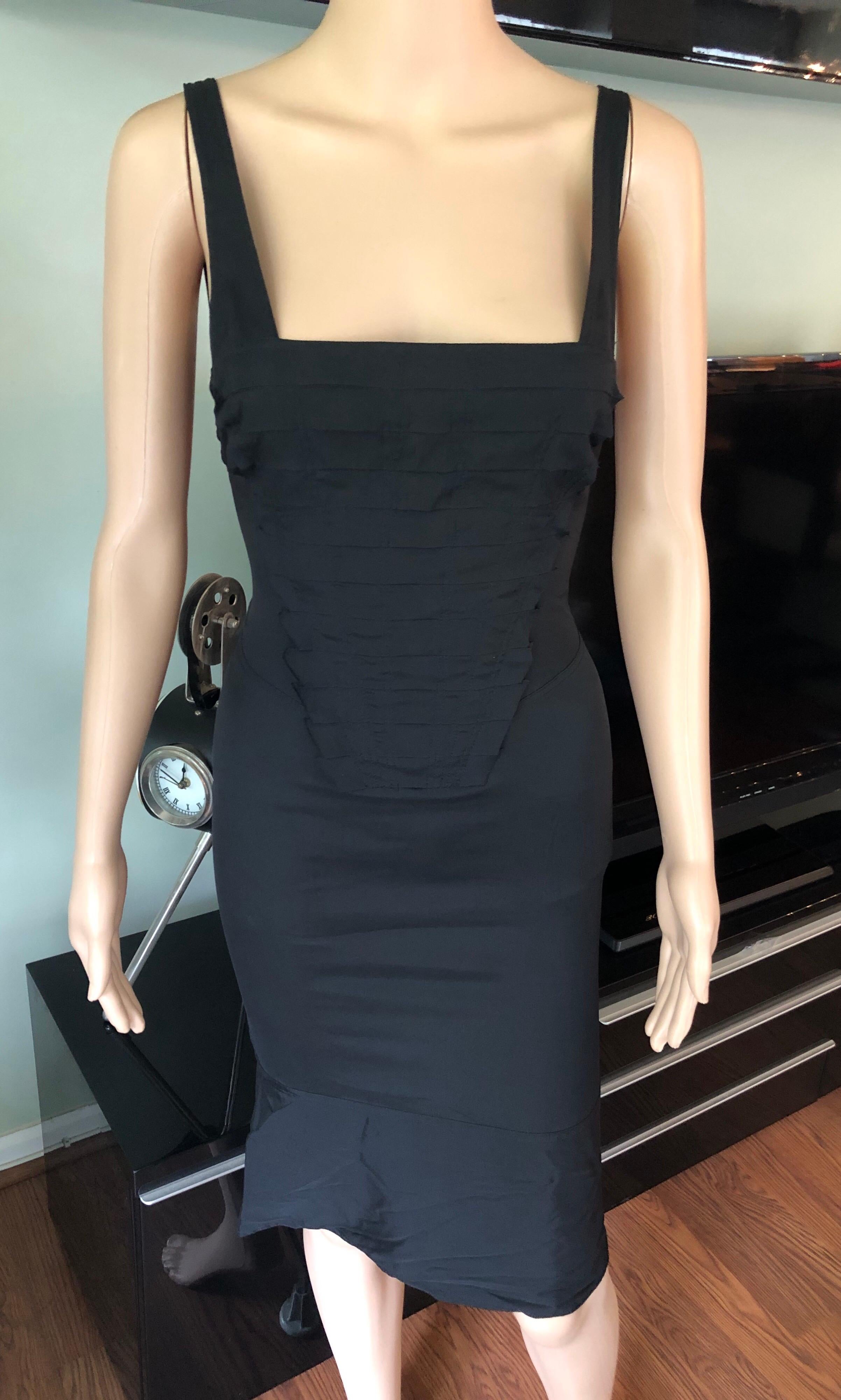 Gucci by Tom Ford S/S 2004 Cutout Black Dress IT 42

Gucci dress with tiered accents, square neckline and concealed zip closure at side. 

