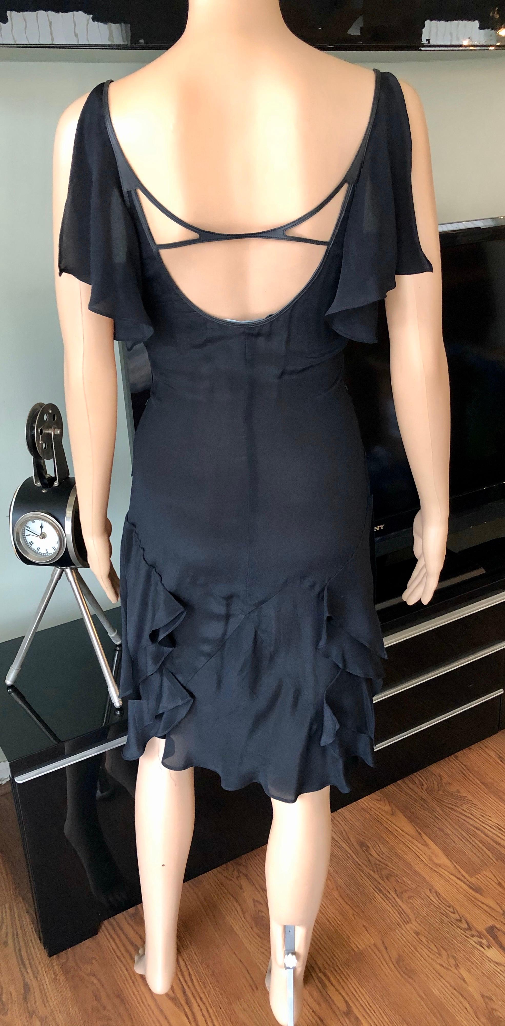 Gucci by Tom Ford S/S 2004 Cutout Plunged Neckline Black Dress IT 40

Gucci sleeveless black knee-length dress featuring ruffled shoulders, cutouts at front and back and concealed zip closure at side. Fabric tag has been removed.