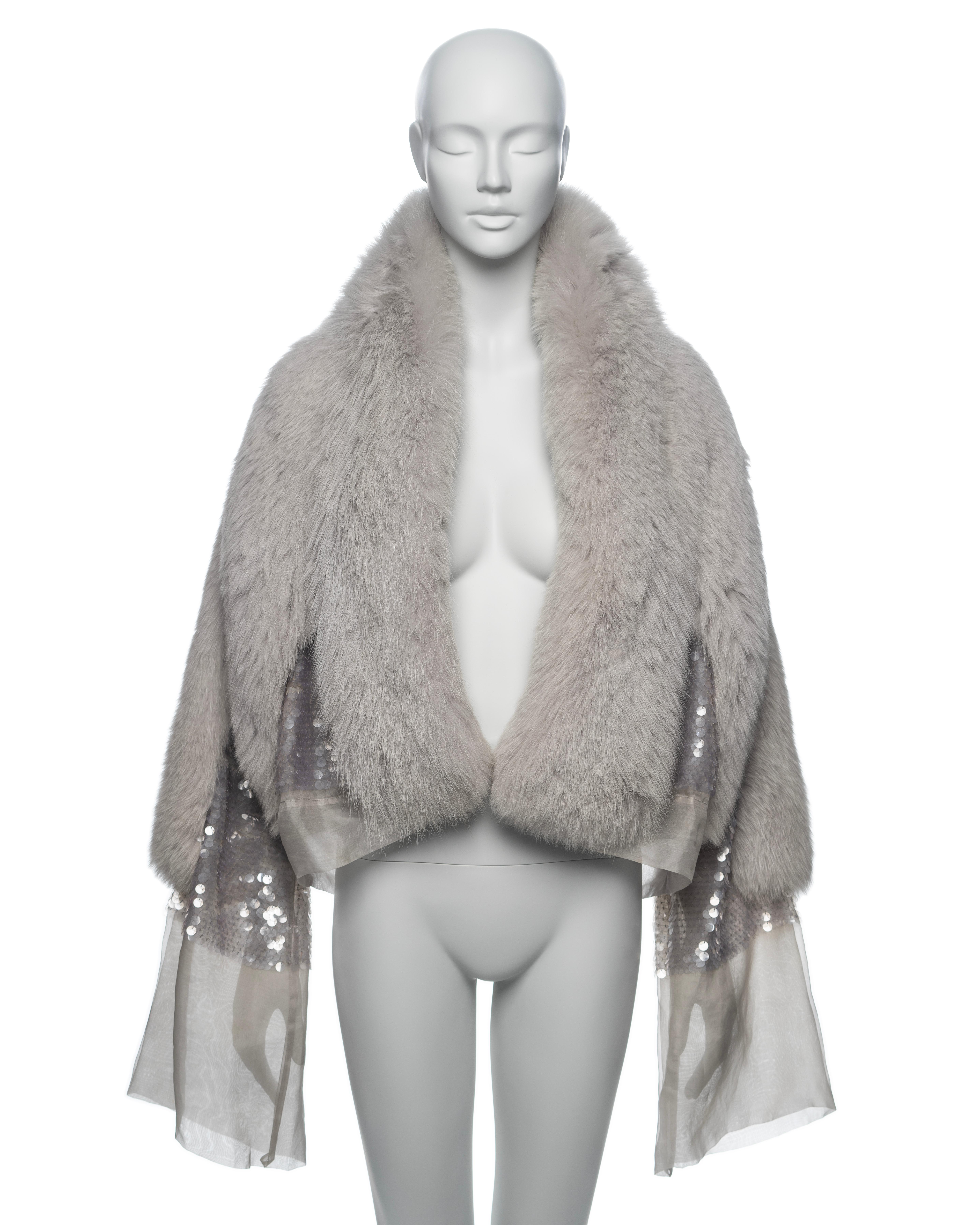 ▪ Brand: Gucci
▪ Creative Director: Tom Ford
▪ Collection: Fall-Winter 2004
▪ Sold by: One of a Kind Archive
▪ Fabric: Silver fox fur on paillette embroidered silk organza 
▪ Details: Secured by wrapping two long ribbon ties around the waist
▪