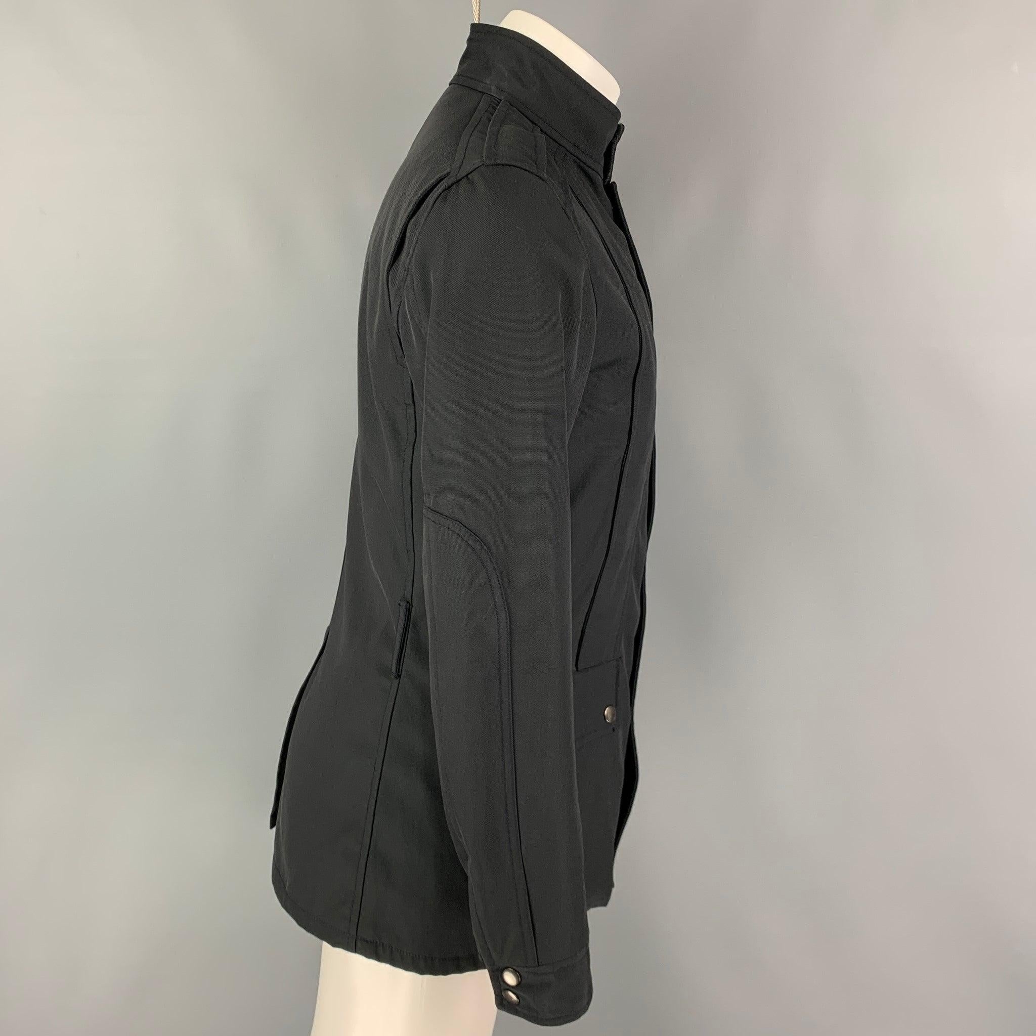 GUCCI by TOM FORD jacket comes in a black cotton / nylon featuring a parka style, front pockets, single back vent, and a snap button closure. Made in Italy.
Very Good
Pre-Owned Condition. 

Marked:  46 

Measurements: 
 
Shoulder: 17 inches Chest: