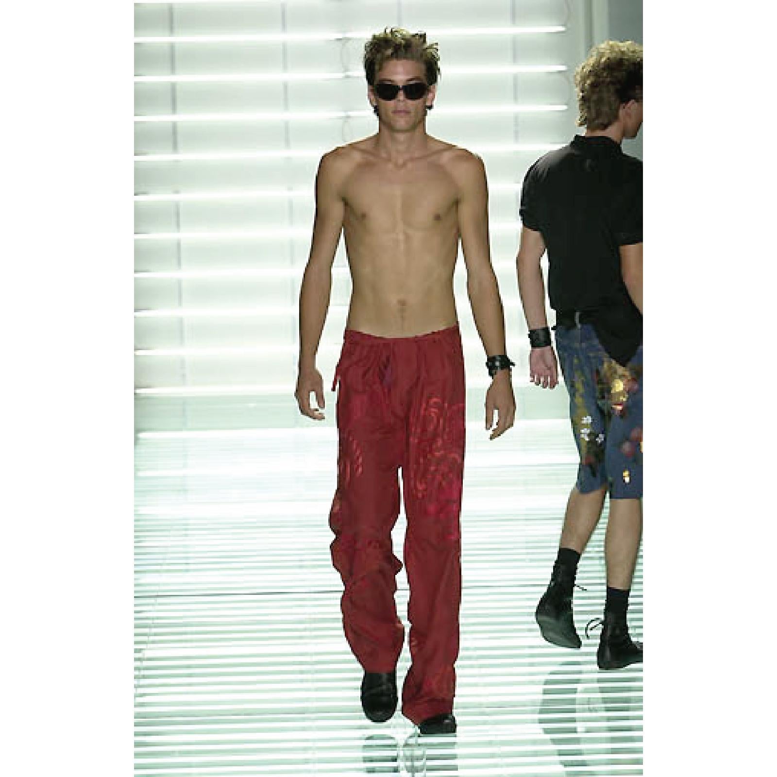 GUCCI by TOM FORD Spring Summer 2001 Collection karate style pants come in red silk with dragon embroidery throughout, button fly, tied drawstring waistband, and quilted hem. Wear . Made in Italy.
 
Gently Loved, Good Pre-Owned Condition.
Marked: IT