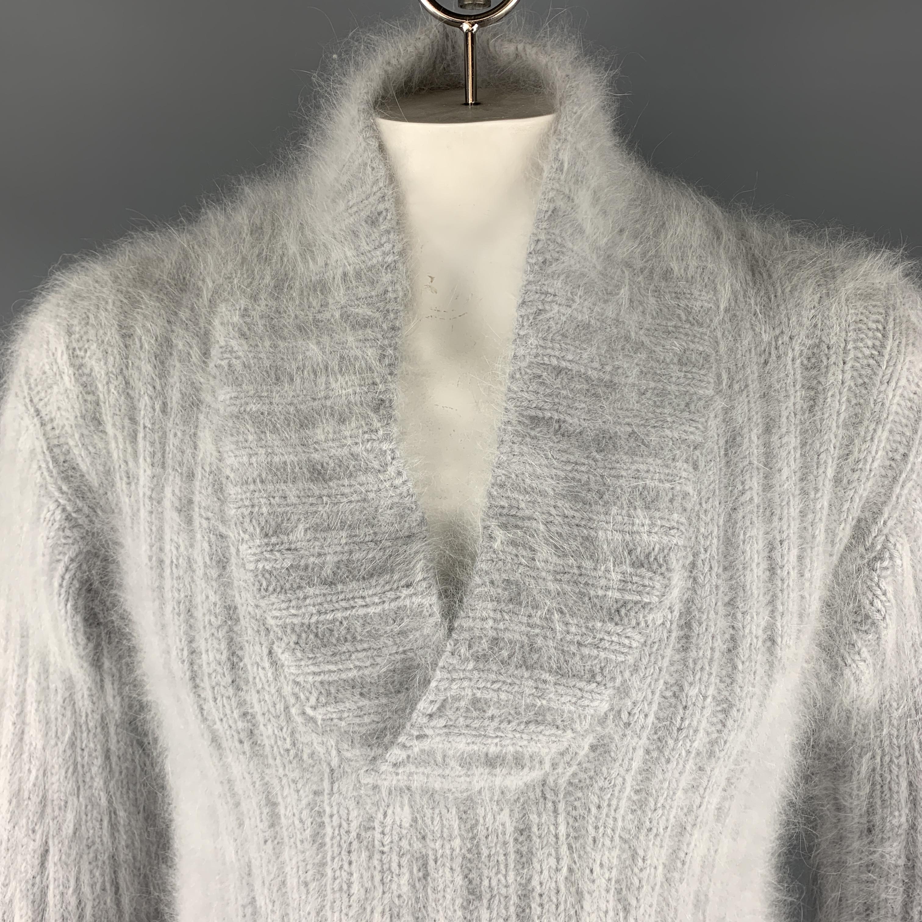 GUCCI by TOM FORD Soft Fuzzy Pullover Sweater comes in a powder blue tone in a knitted Angora blend material, with a open collar. Made in Italy.
 
Excellent Pre-Owned Condition.
Marked: L
 
Measurements:
 
Shoulder: 19 in.
Chest: 42 in.
Sleeve: 25.5