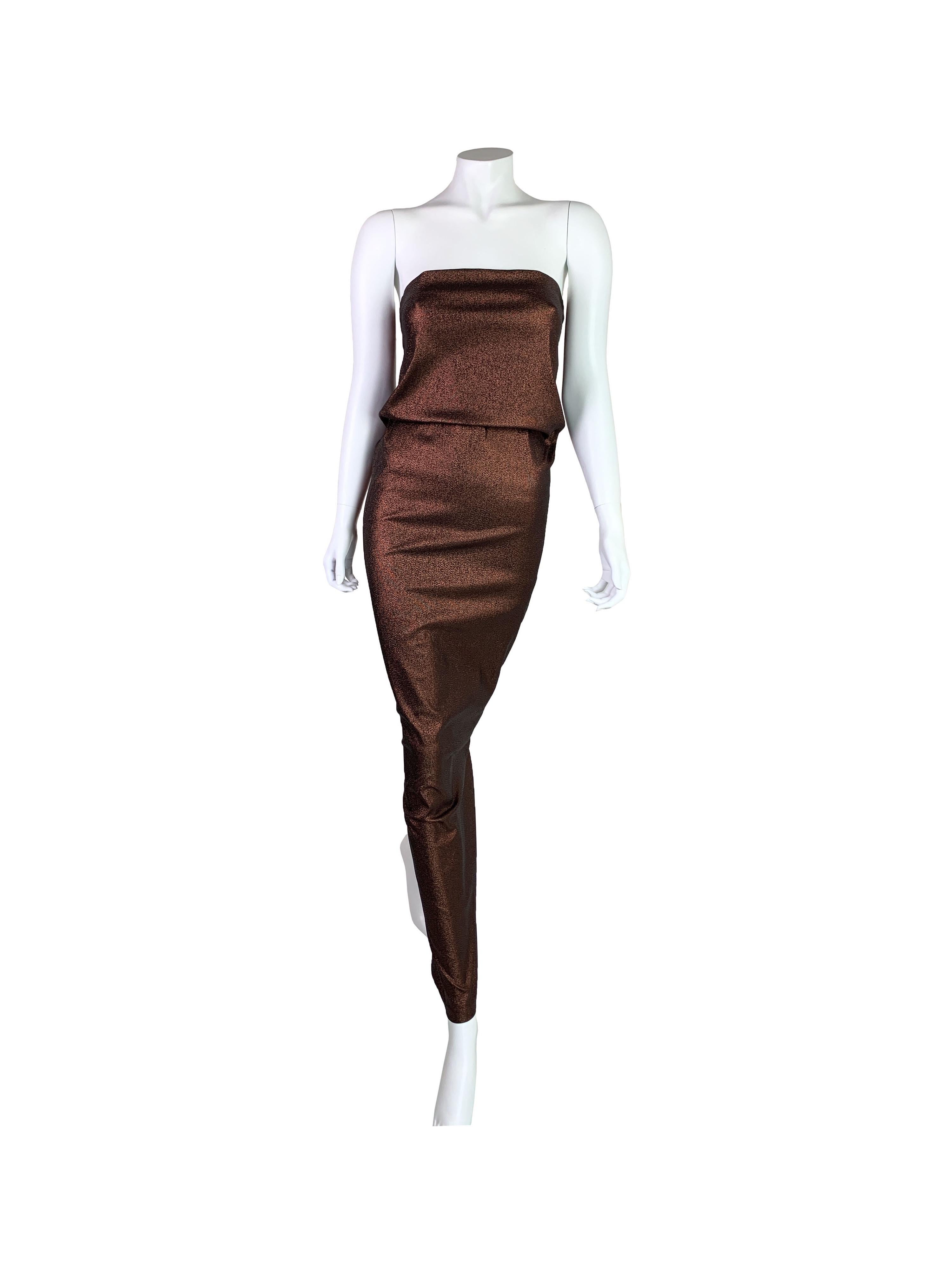 One of Gucci by Tom Ford items that rightfully earned an iconic status. 

This fabulous dark red metallic tube dress has been seen on the runway in one of two closing looks worn by Naomi Campbell. Queen Vin is proud to offer an even more rare maxi