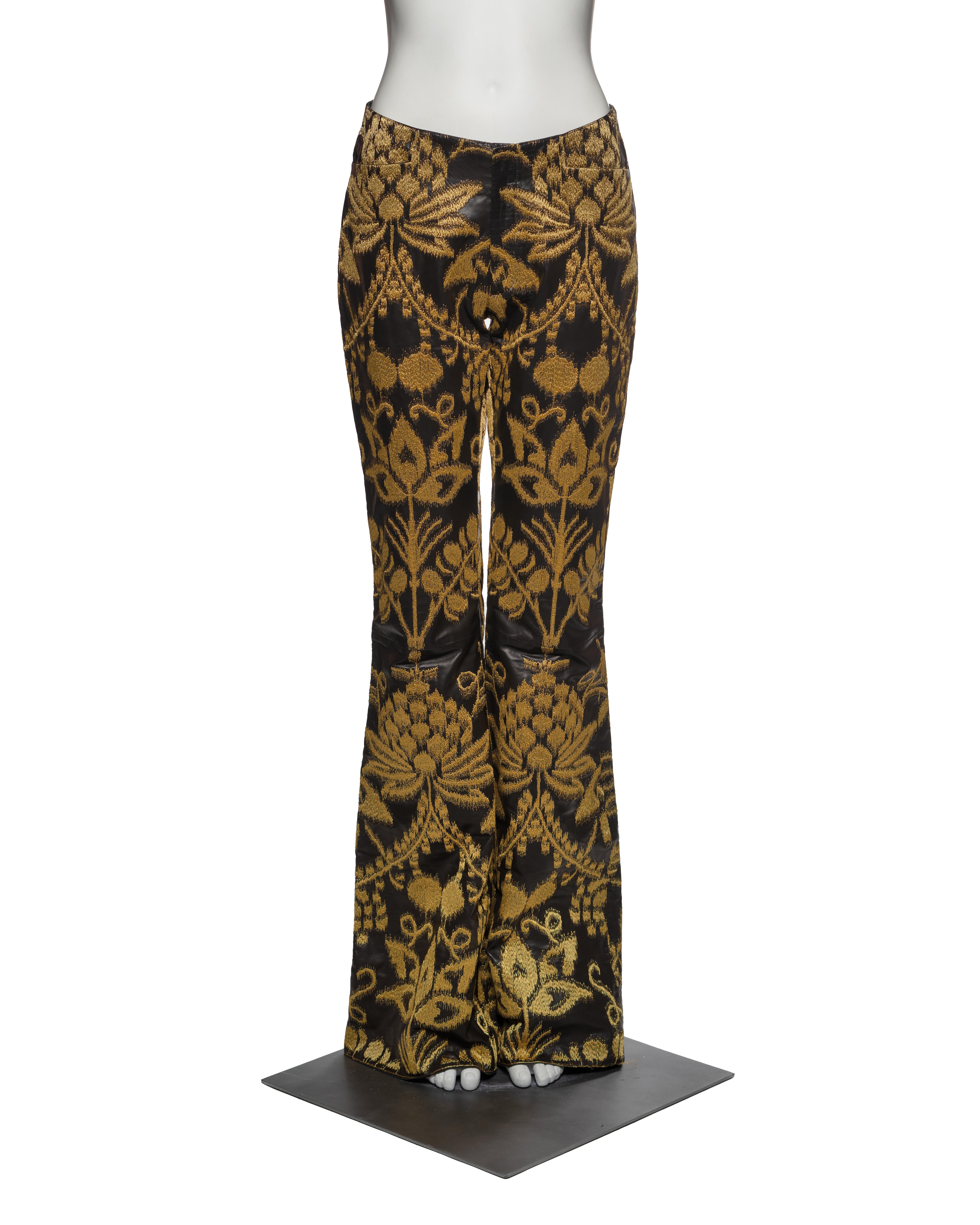 A pair of black leather unisex trousers from Gucci’s Spring-Summer 2000 collection, designed under Tom Ford. The fitted silhouette is tailored with a mid-rise waist and a flared leg, characteristic of Ford’s late 1990s and early 2000s vision. The