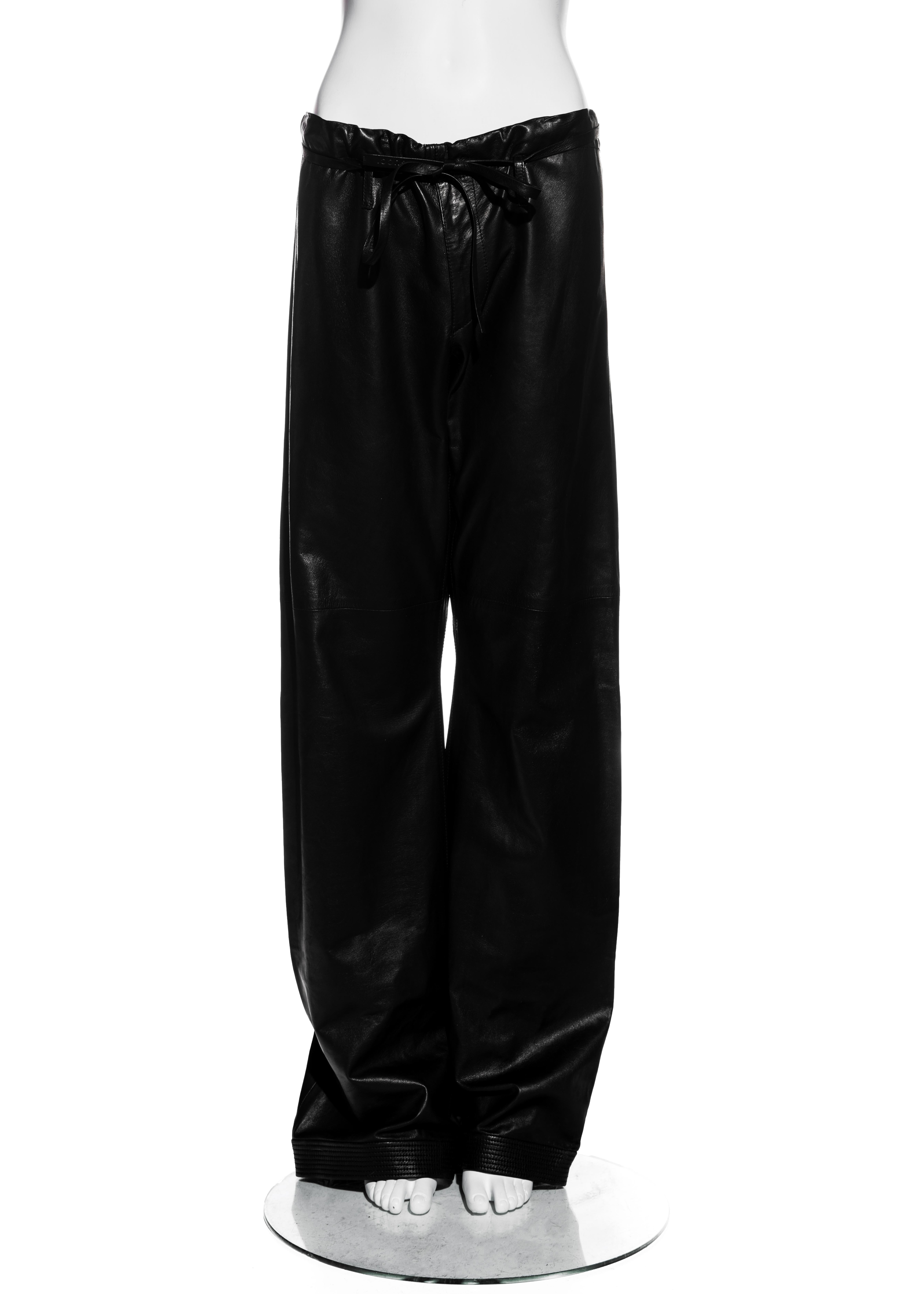 ▪ Gucci unisex black lambskin leather pants 
▪ Designed by Tom Ford
▪ Leather drawstring fastening at waist 
▪ Slits at both sides of waist
▪ Stitching detail at hem
▪ Wide leg 
▪ Mens Size 46 (would fit bigger and smaller sizes)
▪ Spring-Summer 2001