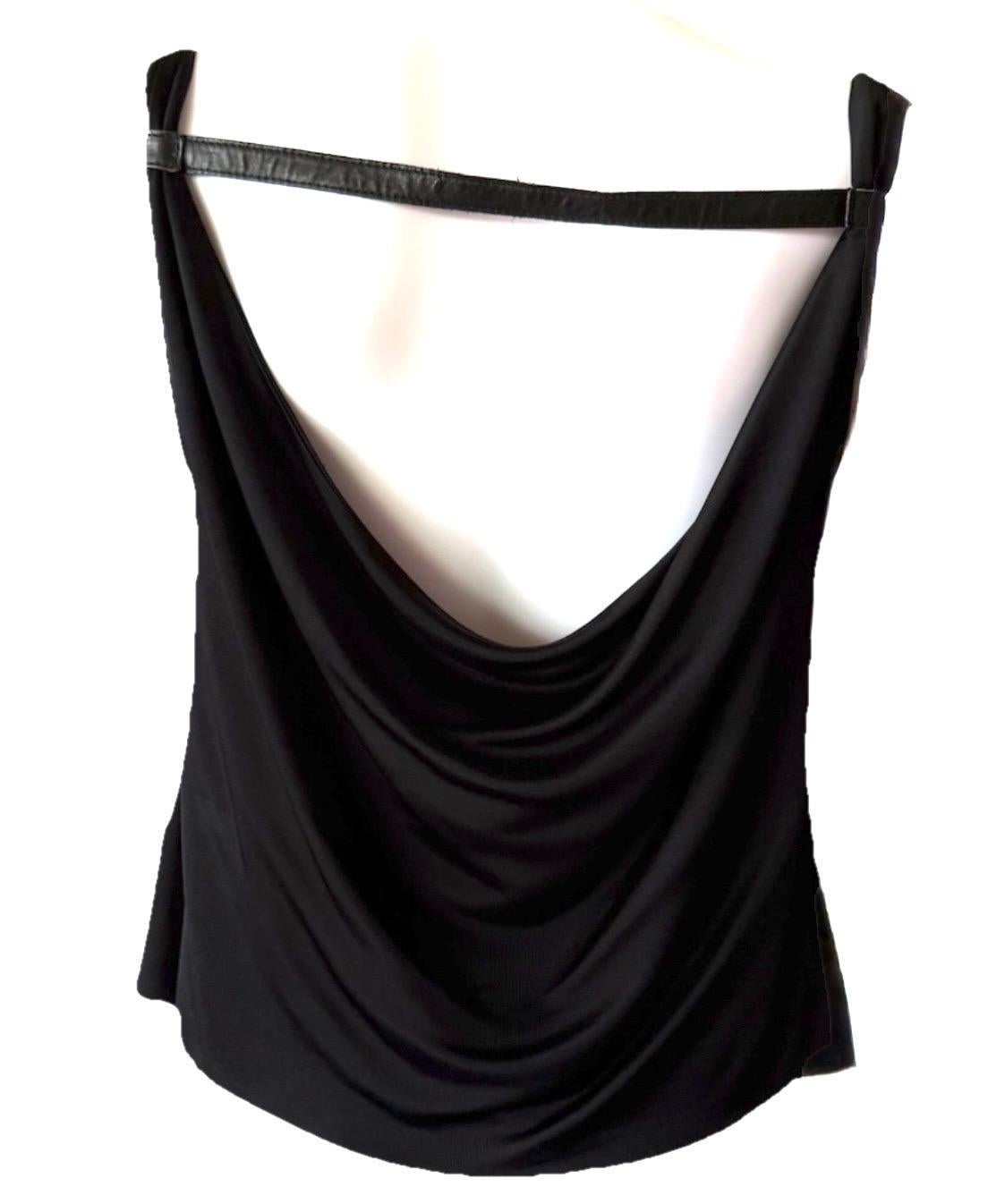 From Tom Ford’s legendary run at Gucci, this Spring 2001 top channels the effortlessly sultry style that defined the era. The draped jersey front skims the body with ease, while the open back—anchored by a single leather strap—is a simple detail