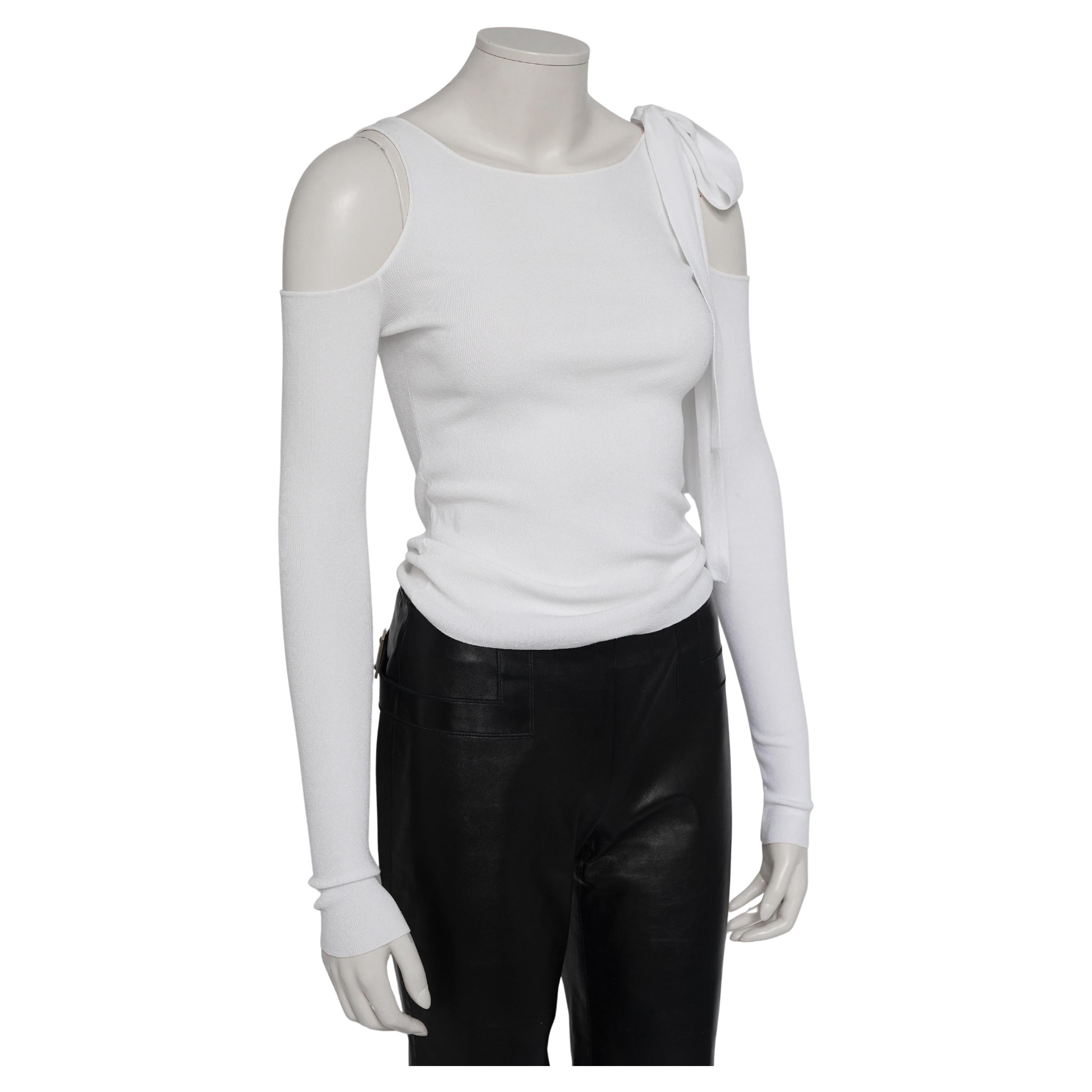From the sensual and sharply tailored era of Tom Ford’s tenure at Gucci, this clean white long-sleeve top exemplifies his signature play on minimalism and provocation. Crafted in Italy from a soft, lightweight stretch fabric with a subtly textured