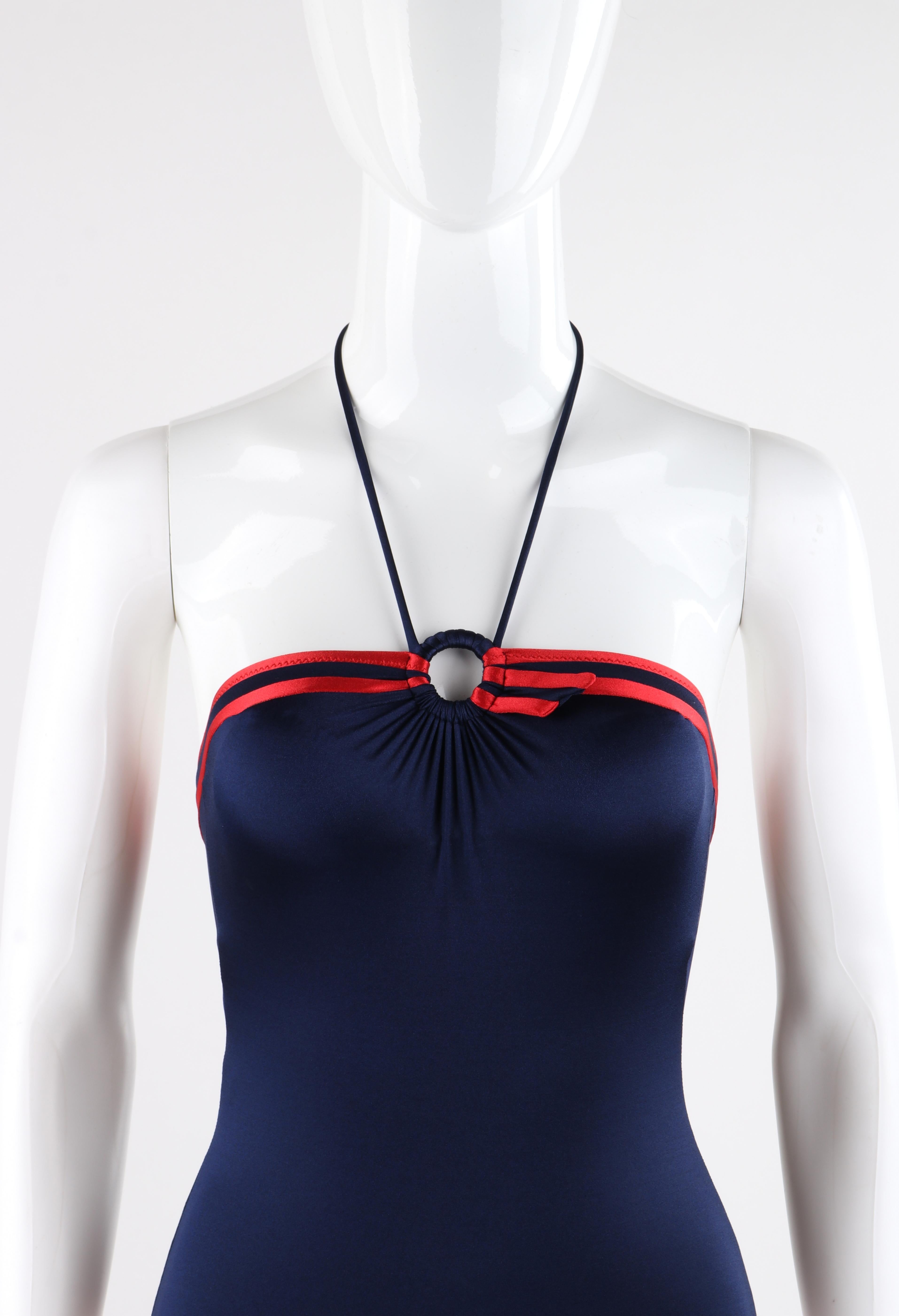 GUCCI c.1980’s Blue Red Trim High Hip Ring Halter One Piece Bathing Swim Suit 
 
Circa: 1980’s
Label(s): Gucci
Style: One piece halter bathing suit
Color(s): Blue and red 
Lined: No
Marked Fabric Content: “80% nylon, 20% elastane” “Lycra”
Unmarked