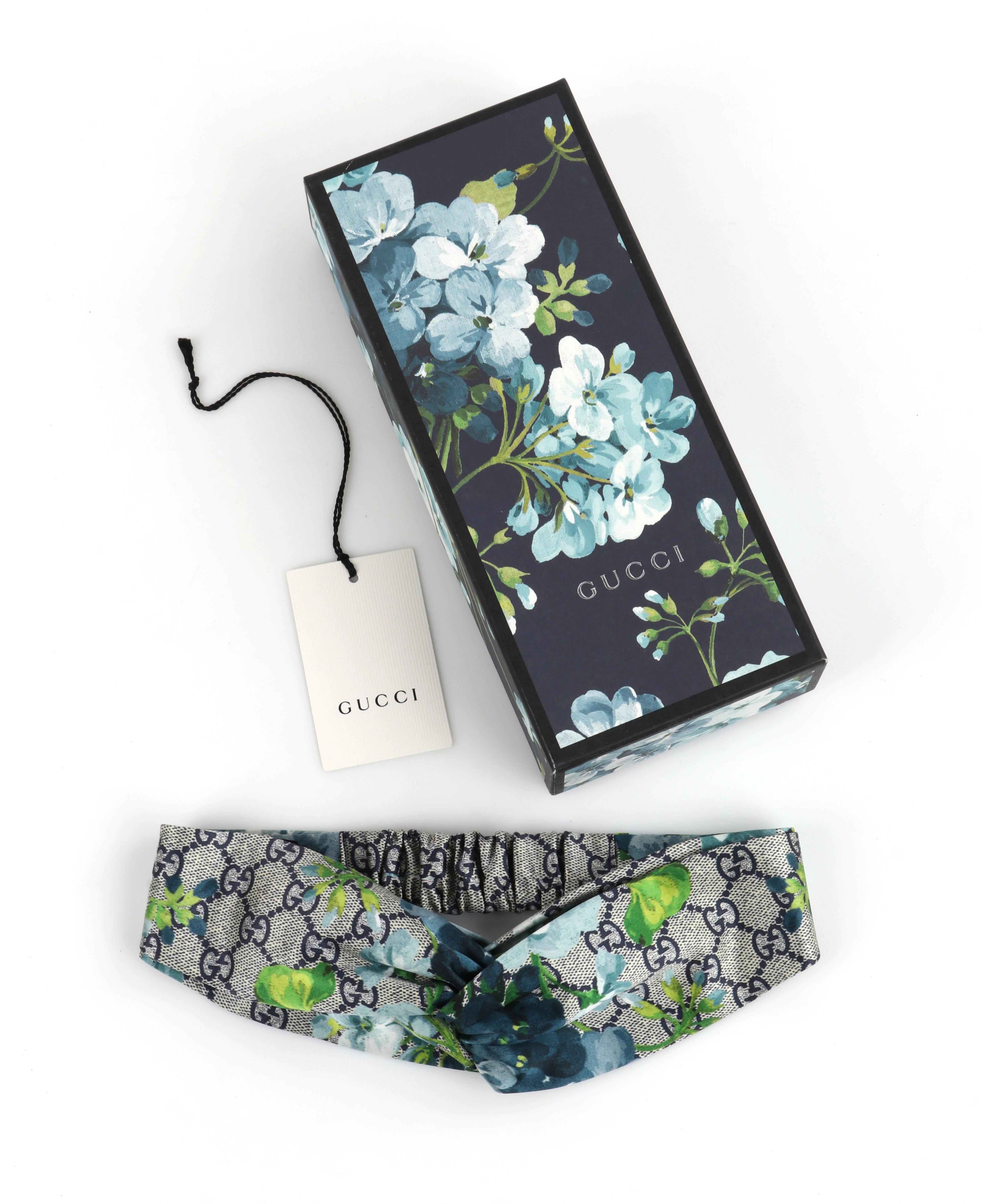GUCCI c.2016 “Blooms” Blue Gray GG Monogram Floral Knotted Silk Headband NWT
 
Brand/Manufacturer: Gucci
Circa: 2016
Designer: Alessandro Michele
Style: Headband
Color(s): Shades of gray, blue, green, white
Lined: No
Marked Fabric Content: “100%
