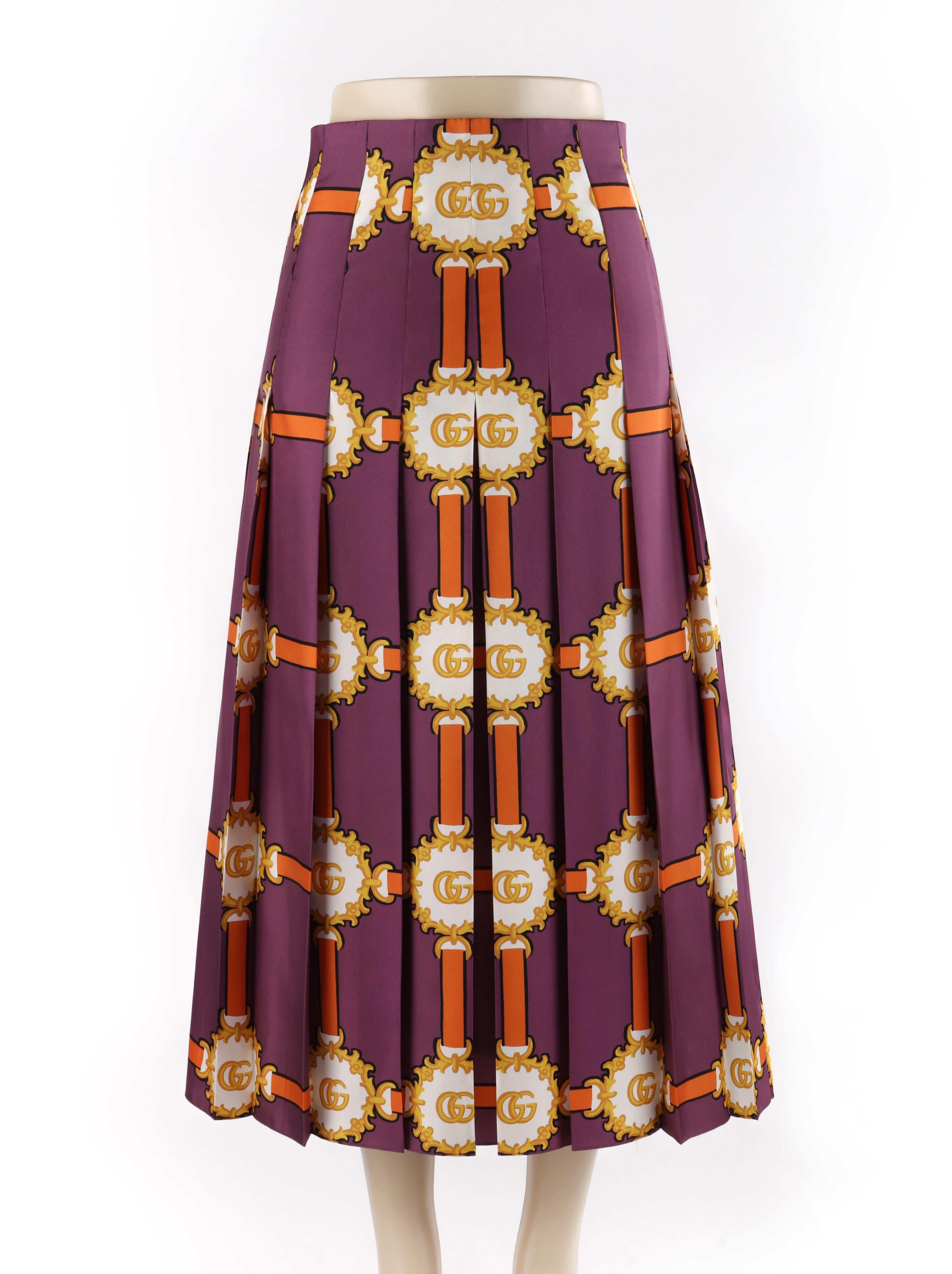 GUCCI c.2019 Purple Gold Marmont GG Doubloon Bridle Harness Silk Pleated Skirt
 
Brand / Manufacturer: Gucci
Circa: 2019 
Designer: Alessandro Michele
Style: Pleated maxi skirt
Color(s): Shades of purple, gold, orange, white
Lined: No
Marked Fabric