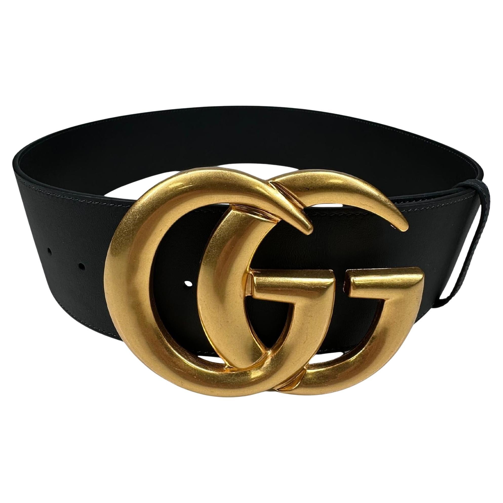 This stylish belt is made of black calfskin leather and features an interlocking GG buckle in antique brass.

Color: Black
Material: Calfskin leather
Item Code: 453265
Size: 95
Measures: L 39” x W 3”
Comes With: Dust bag
Condition: Excellent. Was
