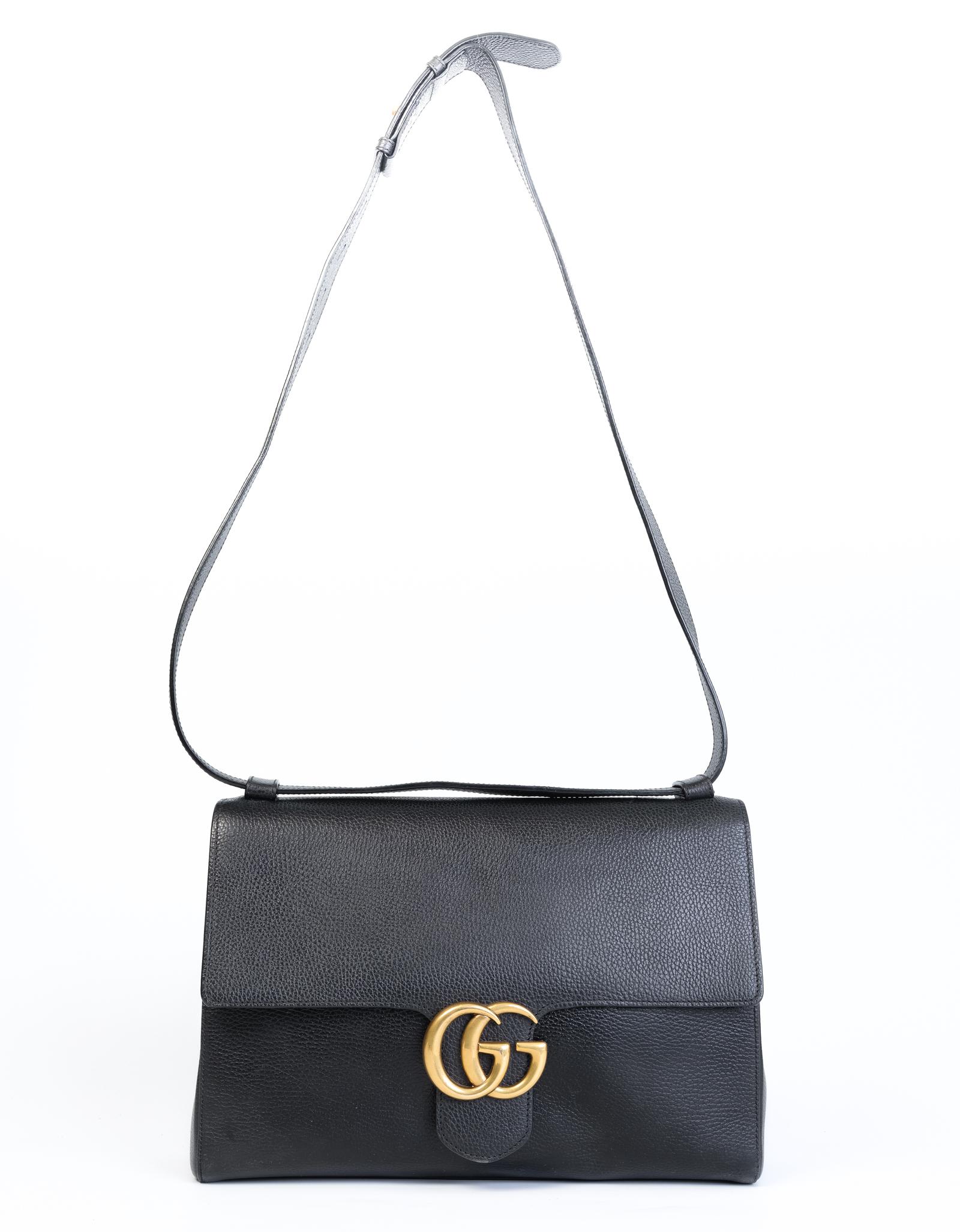 This Gucci Marmont bag is made in lightweight leather with cotton linen lining and antique gold-toned hardware. This bag features one main interior compartment, one wall zip pocket, two slip pockets, and flap closure.

COLOR: Black
MATERIAL: