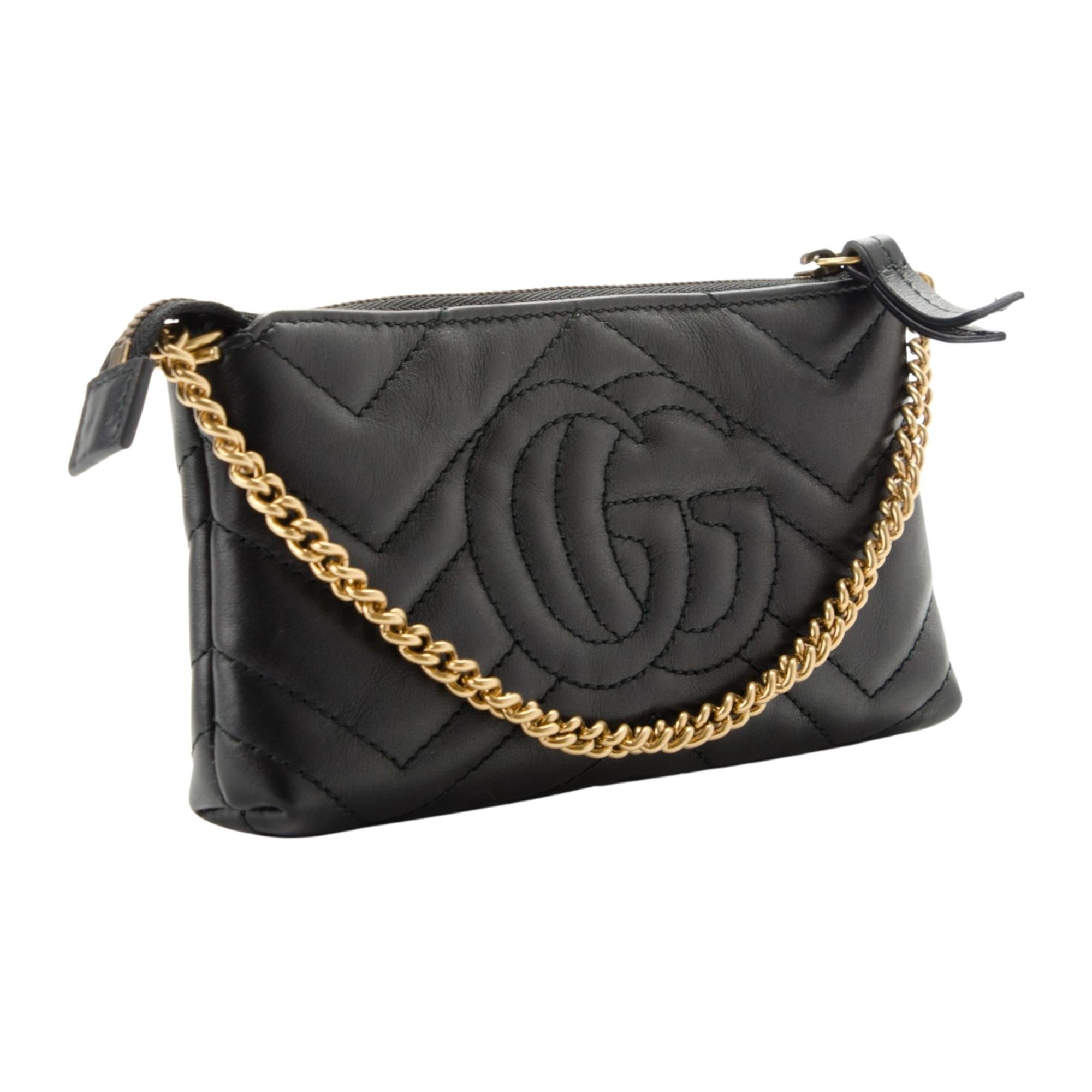 This shoulder bag is crafted of smooth & supple calfskin leather in classic black. This bag features an antiqued gold chain strap and a small antiqued gold GG logo on the front. The top zipper opens to a light beige interior.

COLOR: Black
MATERIAL:
