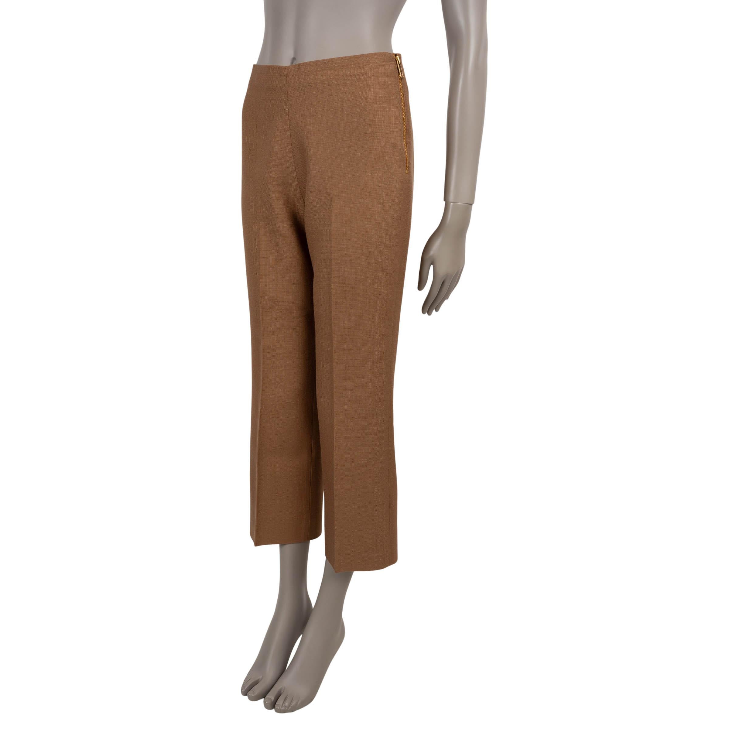 These 100% authentic Gucci pants are crafted in camel brown viscose (100%) and tailored to a flattering mid-rise silhouette. Designed with slightly flared, cropped legs and front creases for a refined look, they open with an exposed gold-tone zipper