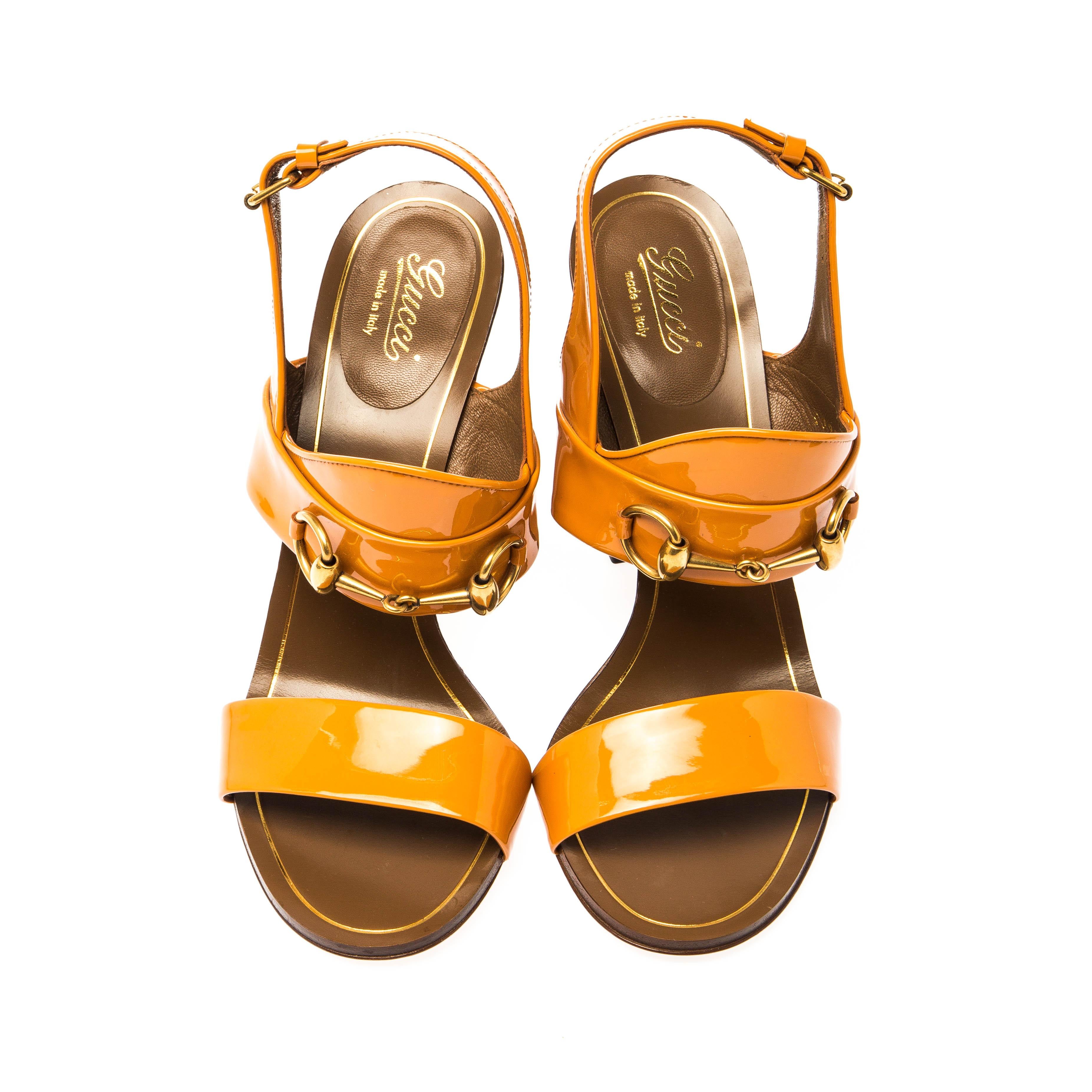 These charming and sophisticated Gucci leather sandals are perfect for dressy days as well as nights. Featuring gold-tone horsebit details on the ankle strap, they exude a feminine appeal. They are equipped with adjustable buckles to ensure comfort