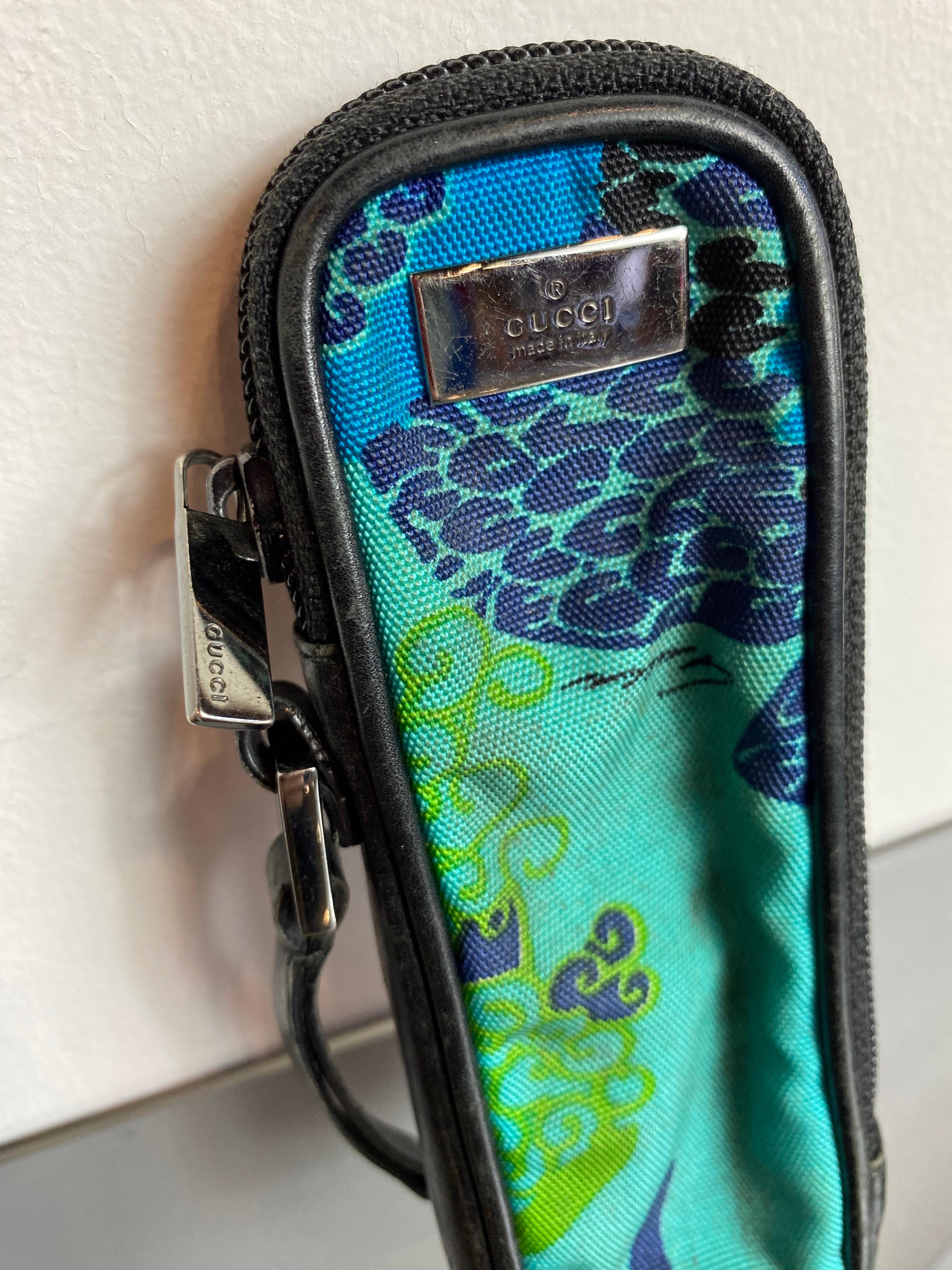 Blue, light blue and black Gucci pencil case with zip and leather inserts. 
It shows signs of use as in the photo. 

Width 5 cm 
Height 16 cm
Depth 2 cm 