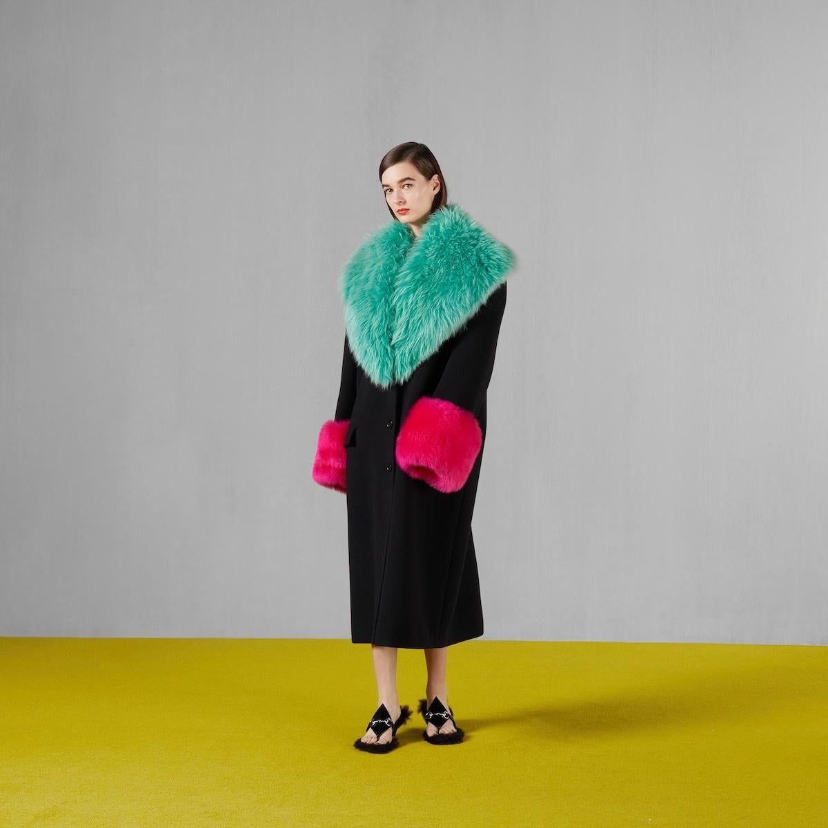Experience pure luxury with the Gucci Women's Cashmere Wool Coat. Made from premium cashmere wool, it’s timeless and elegant. The signature Interlocking G logo adds a refined touch. Its removable shearling collar and cuffs offer versatile styling