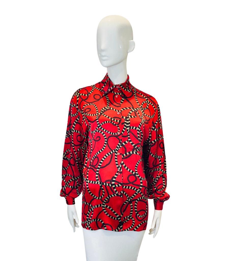 Gucci Chain & Cord Print Silk Shirt
Red longline shirt crafted in silk and designed with all-over chain and cord prints.
Featuring classic collar, centre button closure and relaxed fit.
Size – 40IT
Condition – Very Good (Minor marks to the
