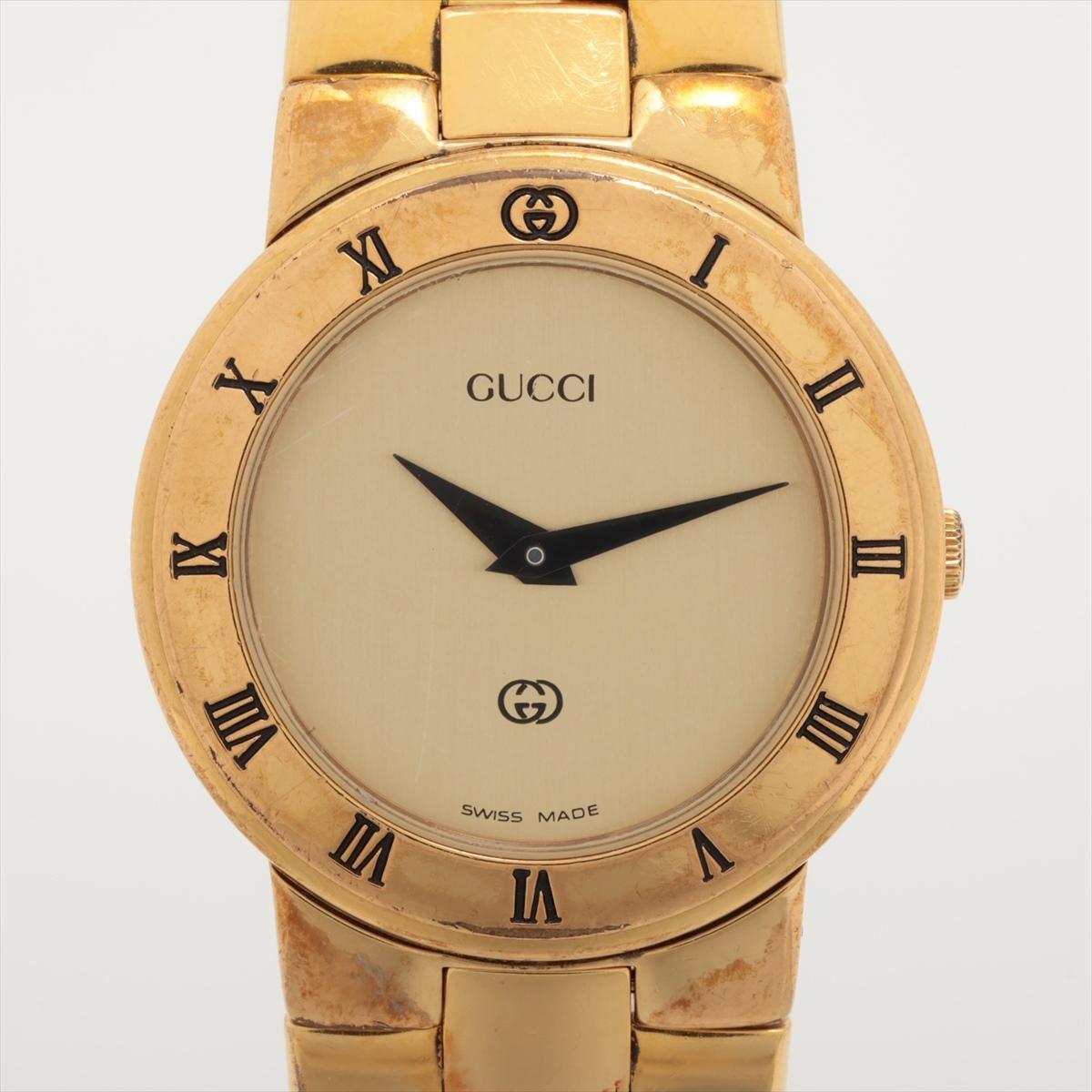 The Gucci Champagne Quartz Watch in gold tone is a sophisticated timepiece that combines elegance with luxury. Featuring a champagne-colored dial, the watch is complemented by a polished gold-tone case and bracelet, creating a refined and timeless