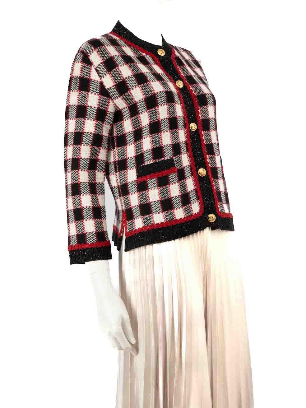 CONDITION is Very good. Minimal wear to cardigan is evident. Minimal wear to the front left pocket where a loose thread can be seen on this used Gucci designer resale item.
 
 
 
 Details
 
 
 Multicolour- black, white, red
 
 Wool
 
 Knit cardigan
