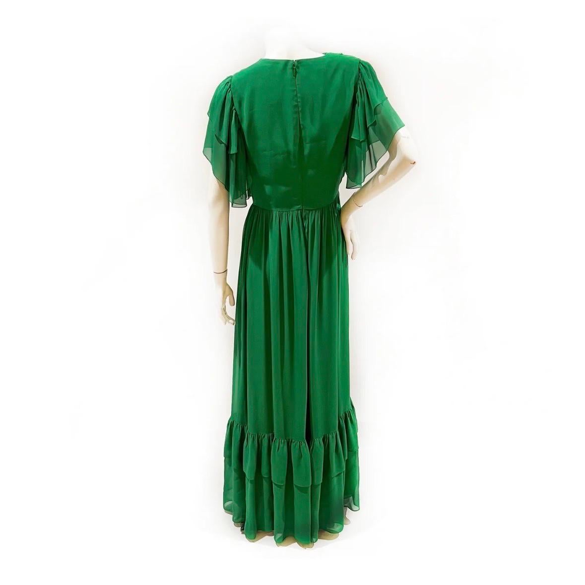 Chiffon ruffle maxi dress by Gucci 
Circa 2019
Made in Italy 
Kelly green
Ruched detail on shoulders 
Ruffle layered semi-sheer sleeves
Wrapped bust 
Double layer of ruffles at bottom hem 
Back zipper and hook closure 
100% viscose, (lining 76%