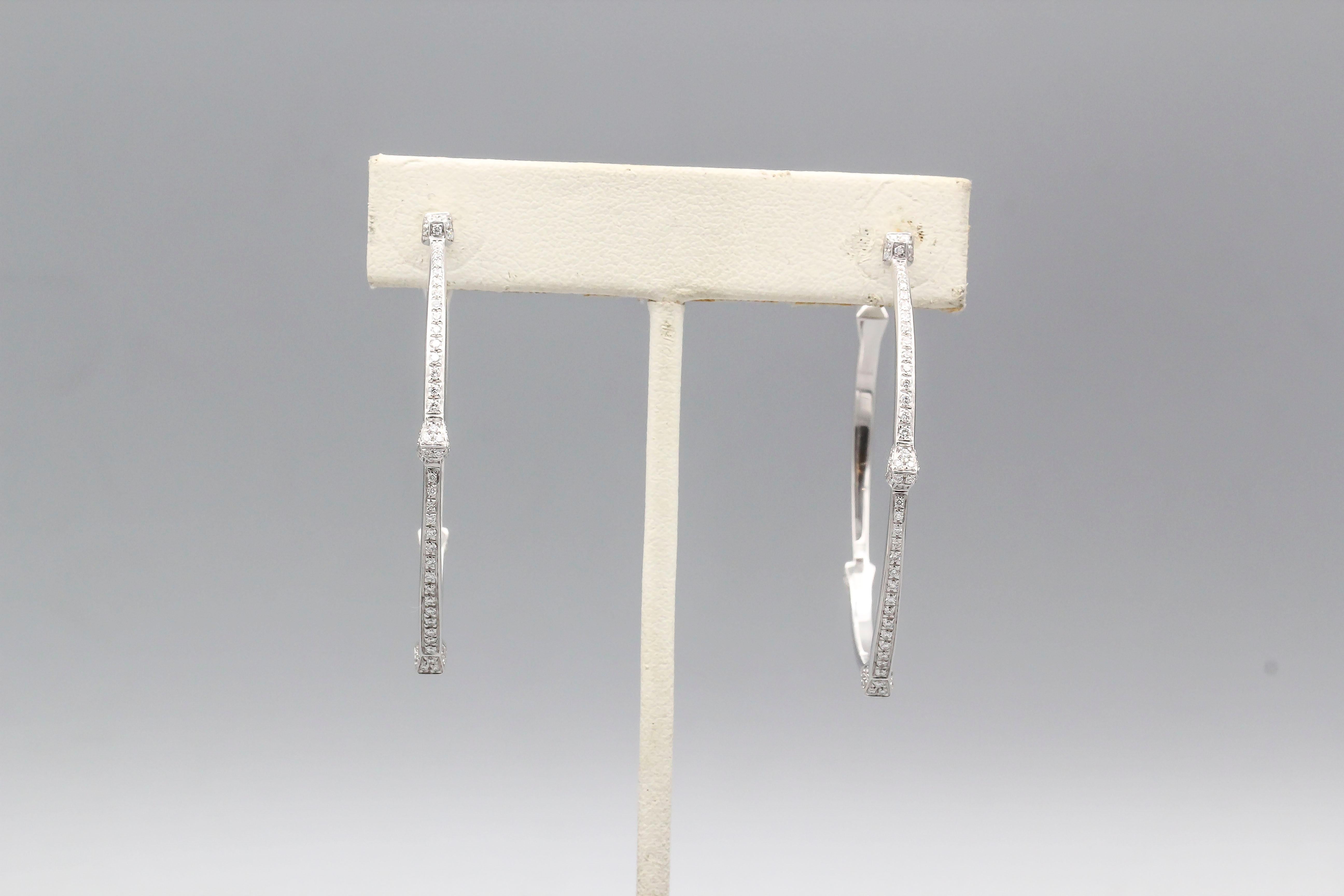 Fine pair of diamond and 18k white gold hoop earrings from the 