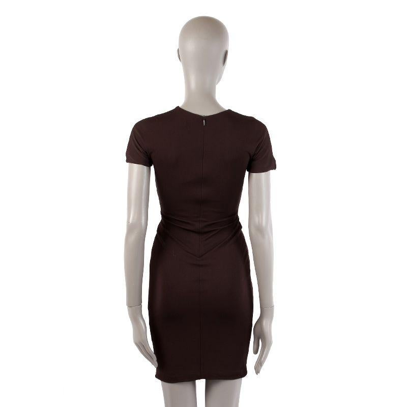 Gucci short-sleeve jersey dress in chocolate brown viscose blend (assumed as tag is missing). With gathered front held by golden rectangle clip. Closes with invisible back zipper. Lined in chocolate brown fabric. Has been worn and is in excellent