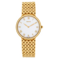 Gucci Classic Ref. 701M Uhr in 18k Gelbgold auf 18k Mesh-Armband