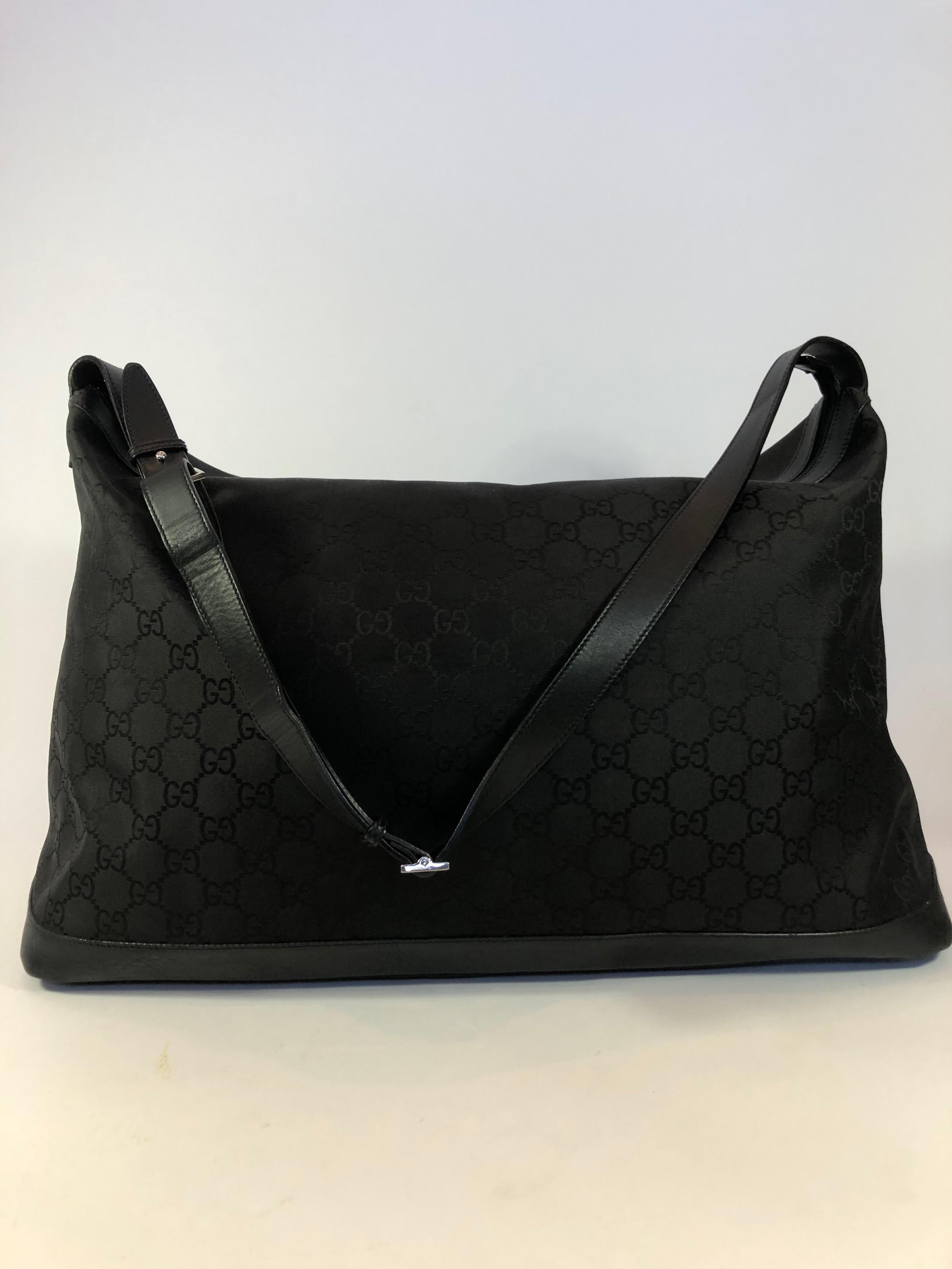 Gucci Soft Black on Black GG Logo Duffle Bag with strap. Condition of bag is clean with no odors.

*MEASUREMENTS*
Length: 23