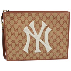Gucci clutch in monogram canvas – New York Yankees collection.
