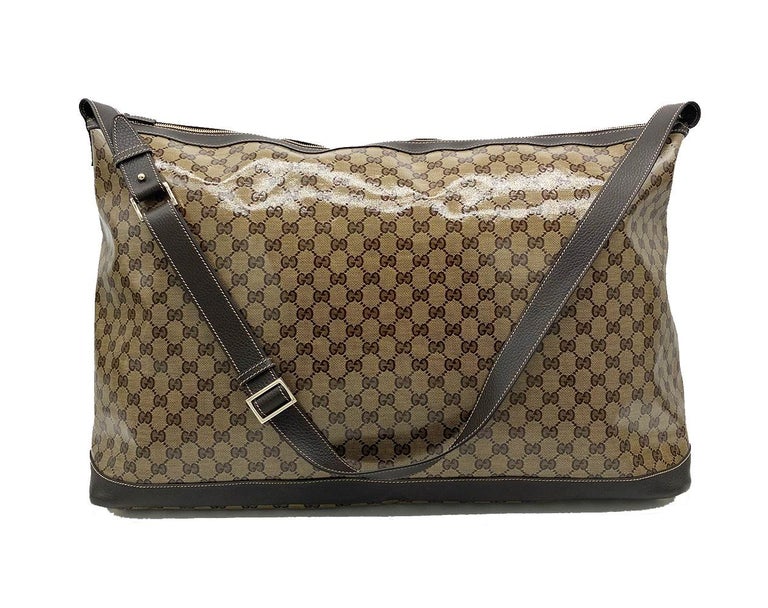 Gucci Coated Monogram Canvas Large Travel Tote Shoulder Bag in excellent condition. Rare XL oversized style perfect for work or play. Coated monogram canvas exterior trimmed with brown leather, cream top stitching and an adjustable leather shoulder