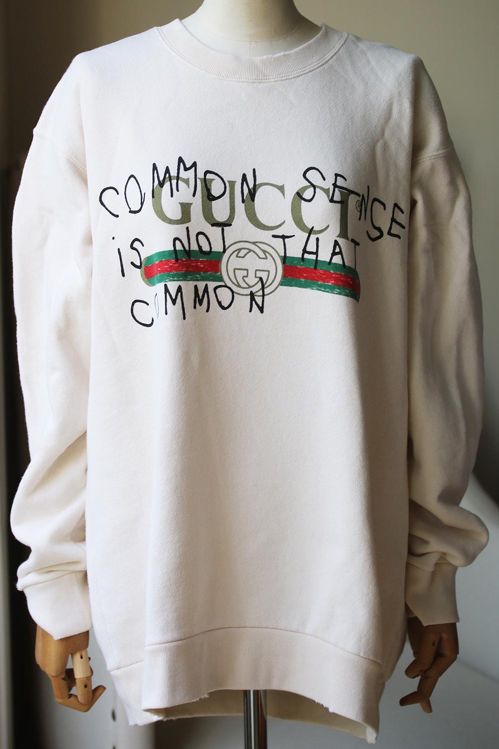 Gucci cotton-jersey sweatshirt. Slips on. Round neck, long sleeves, oversized, graffiti logo-print at front, distressed ribbed trims. 100% cotton.

Size: Medium (UK 10, US 6, FR 38, IT 42)

Condition: As new condition, no sign of wear. 