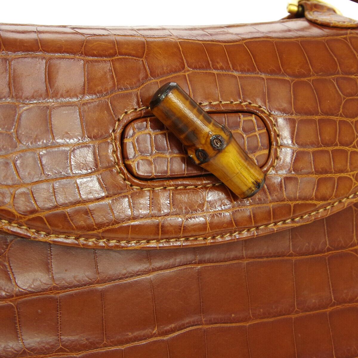 
Crocodile
Leather
Bamboo
Gold tone hardware
Made in Italy
Handle drop 4.75
