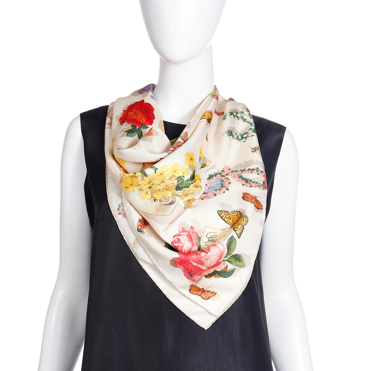 The gorgeous Gucci silk scarf is in a tranquil light beige with taupe hand rolled edges. The whimsical print features an ensemble of butterflies, bees, insects, and pretty flowers and leaves, each rendered with unique shadowing effects. The shades,