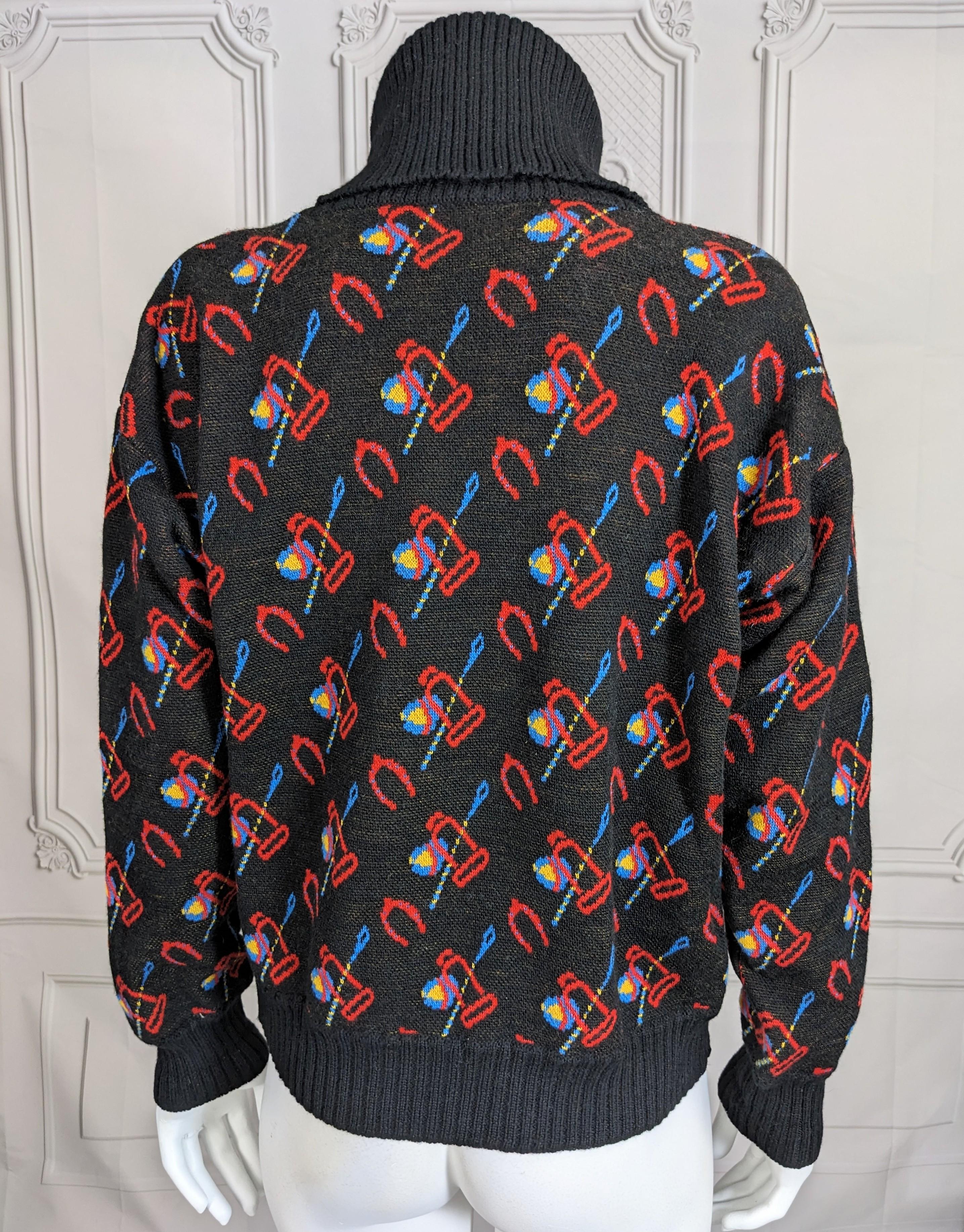 Charming Vintage Gucci Black Wool Sweater from the 1980's with bright inflected colorations of the period. High ribbed turtleneck with deep sleeves and body intarsia knit with bright riding crop and stirrup motifs. Very reminiscent of fun, playful