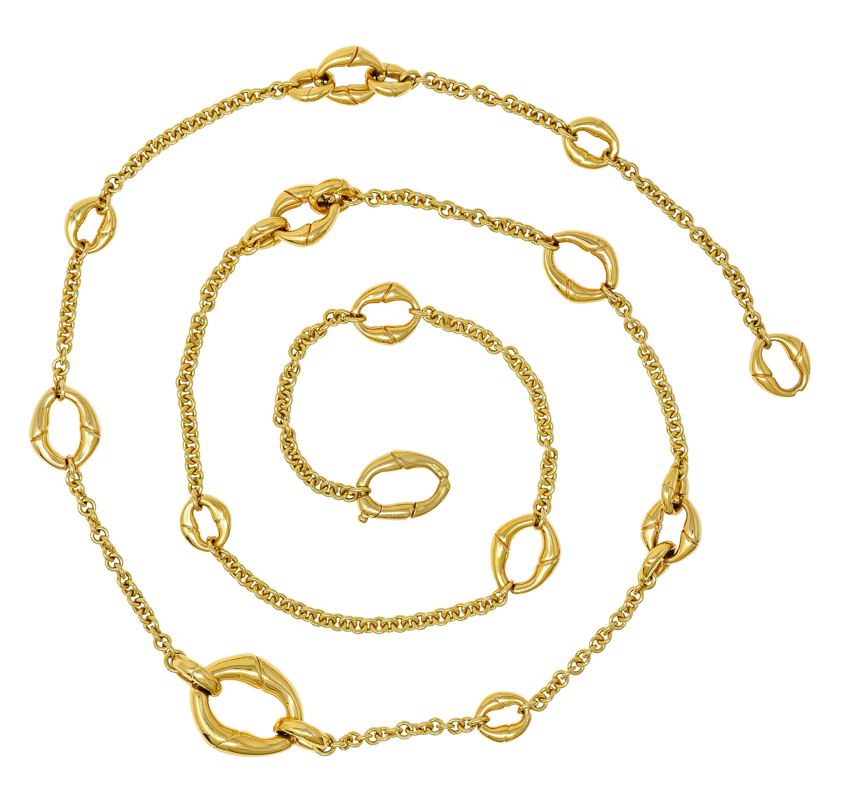 Gucci Contemporary 18 Karat Yellow Gold Bamboo Link Station Necklace. Comprised of cable chain with grooved oval shaped bamboo motif stations. Varying in size with a high polish finish. Links vary in size from 3/8 x 3/8 inch to 7/8 x 1 inch.