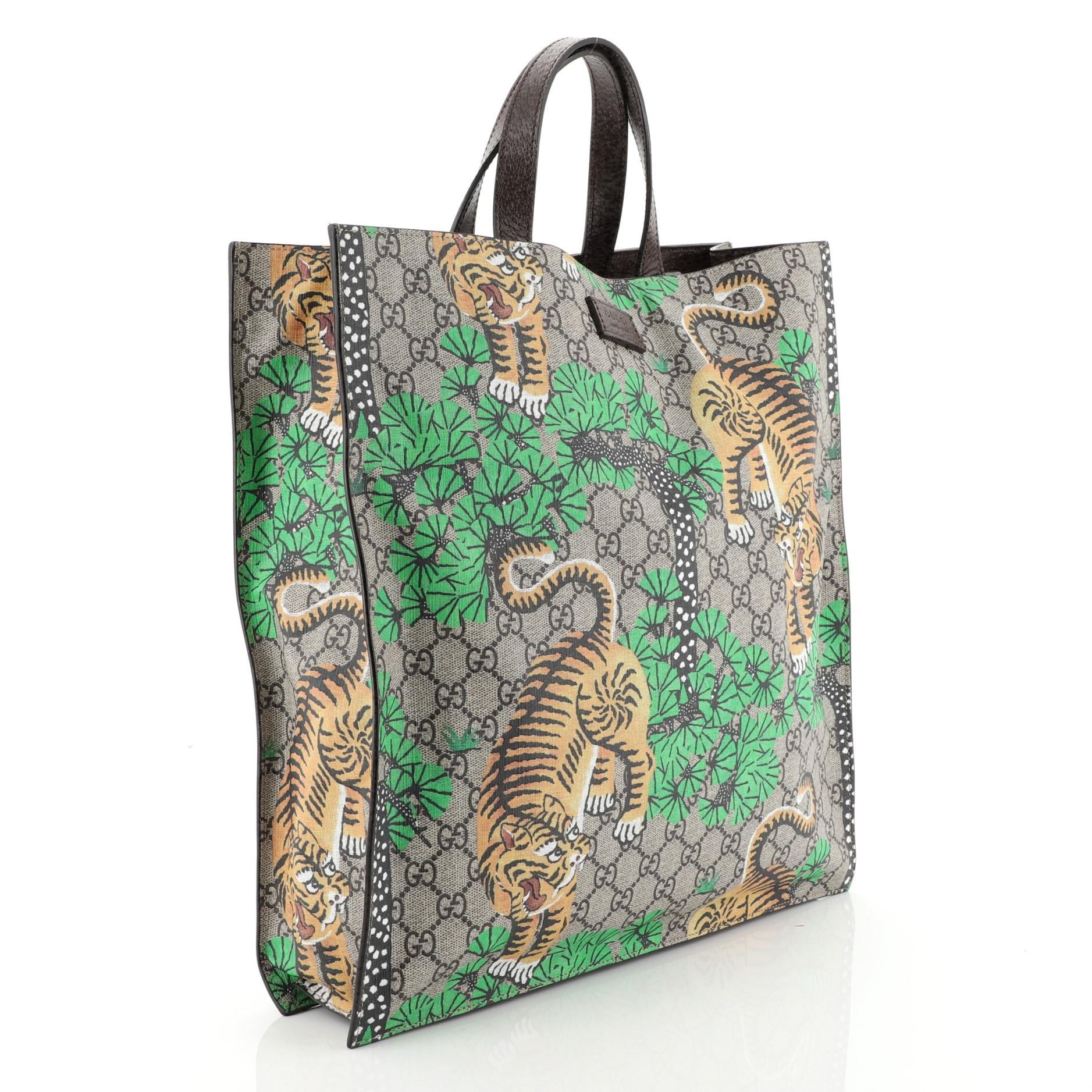 This Gucci Convertible Soft Open Tote Bengal Print GG Coated Canvas Tall, crafted in brown GG coated canvas with Bengal print overlay, features dual leather handles and aged gold-tone hardware. Its magnetic closure opens to a brown microfiber