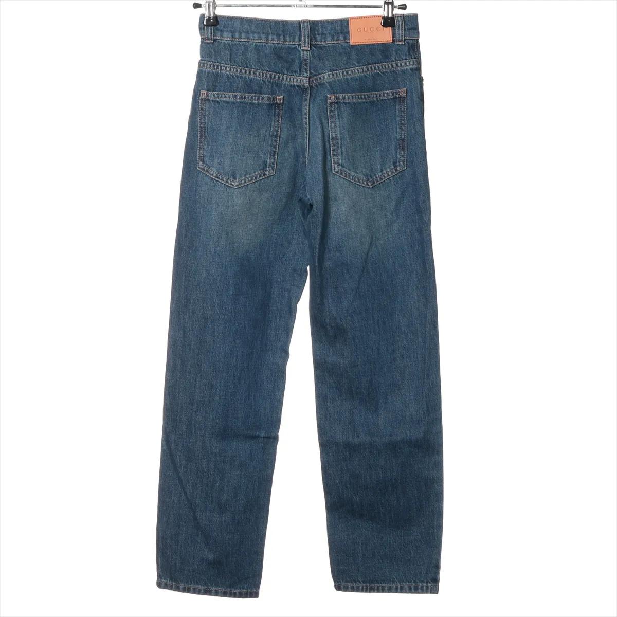 Viola Pantaloni in denim di cotone di Gucci in vendita