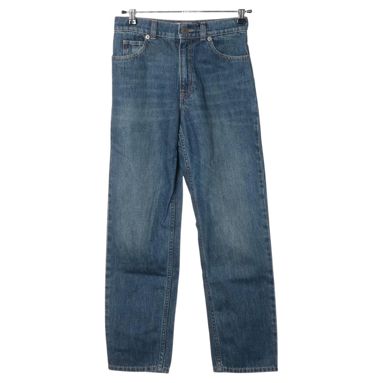 Pantaloni in denim di cotone di Gucci in vendita