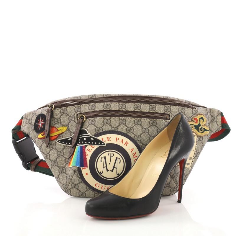 This Gucci Courrier Zip Belt Bag GG Coated Canvas with Applique, crafted from GG coated canvas with applique, features a web belt strap, exterior zip pocket, and gold-tone hardware. Its zip closure opens to a beige canvas interior. **Note: Shoe
