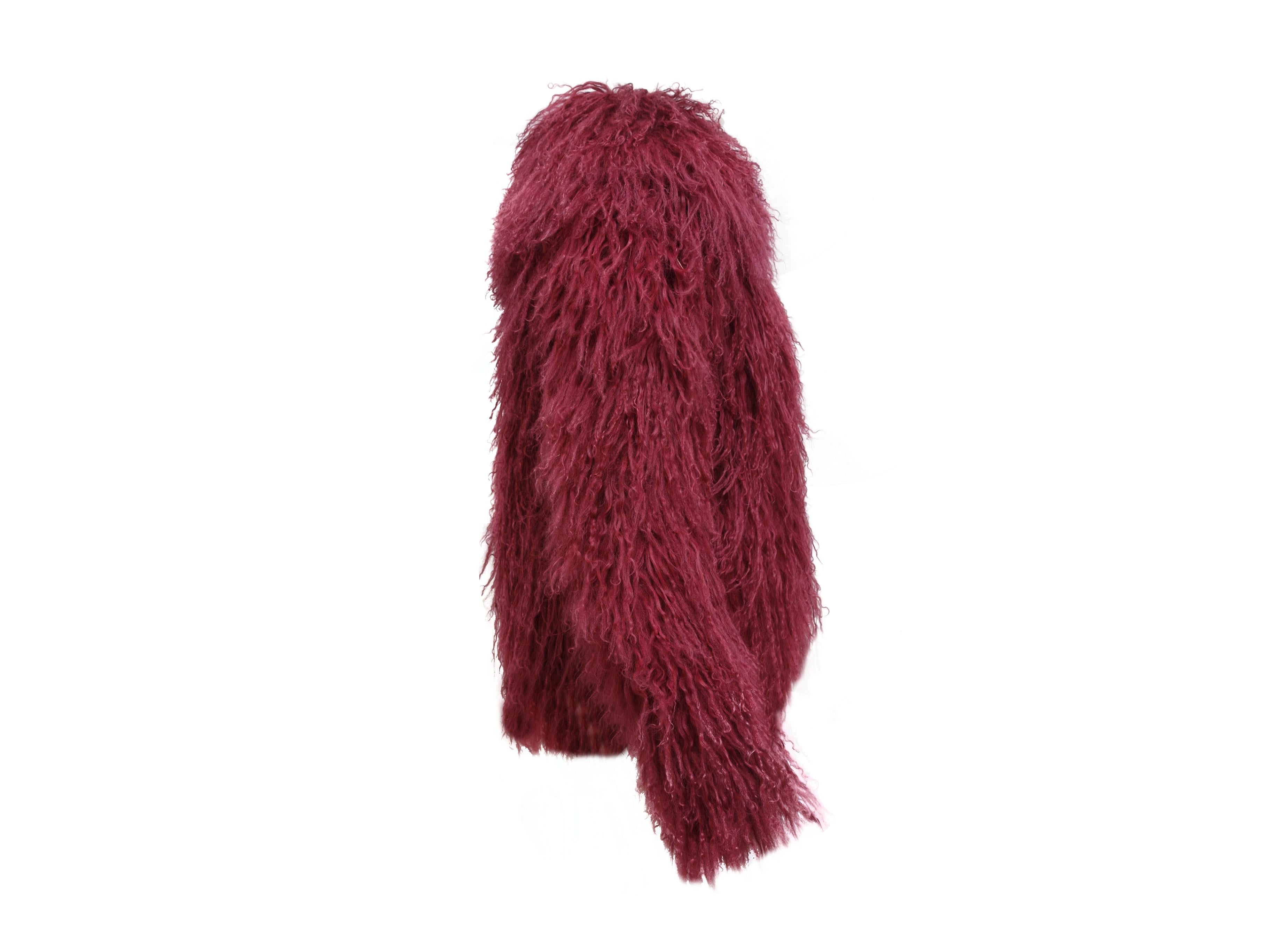 Product details:  Cranberry/Purple  Gucci Mongolian Lamb Jacket. Mongolian Lamb is sometimes known as Curly Lamb, as the fur has long curls. This Gucci fur jacket has a wide collar and hook and eye closures. 38