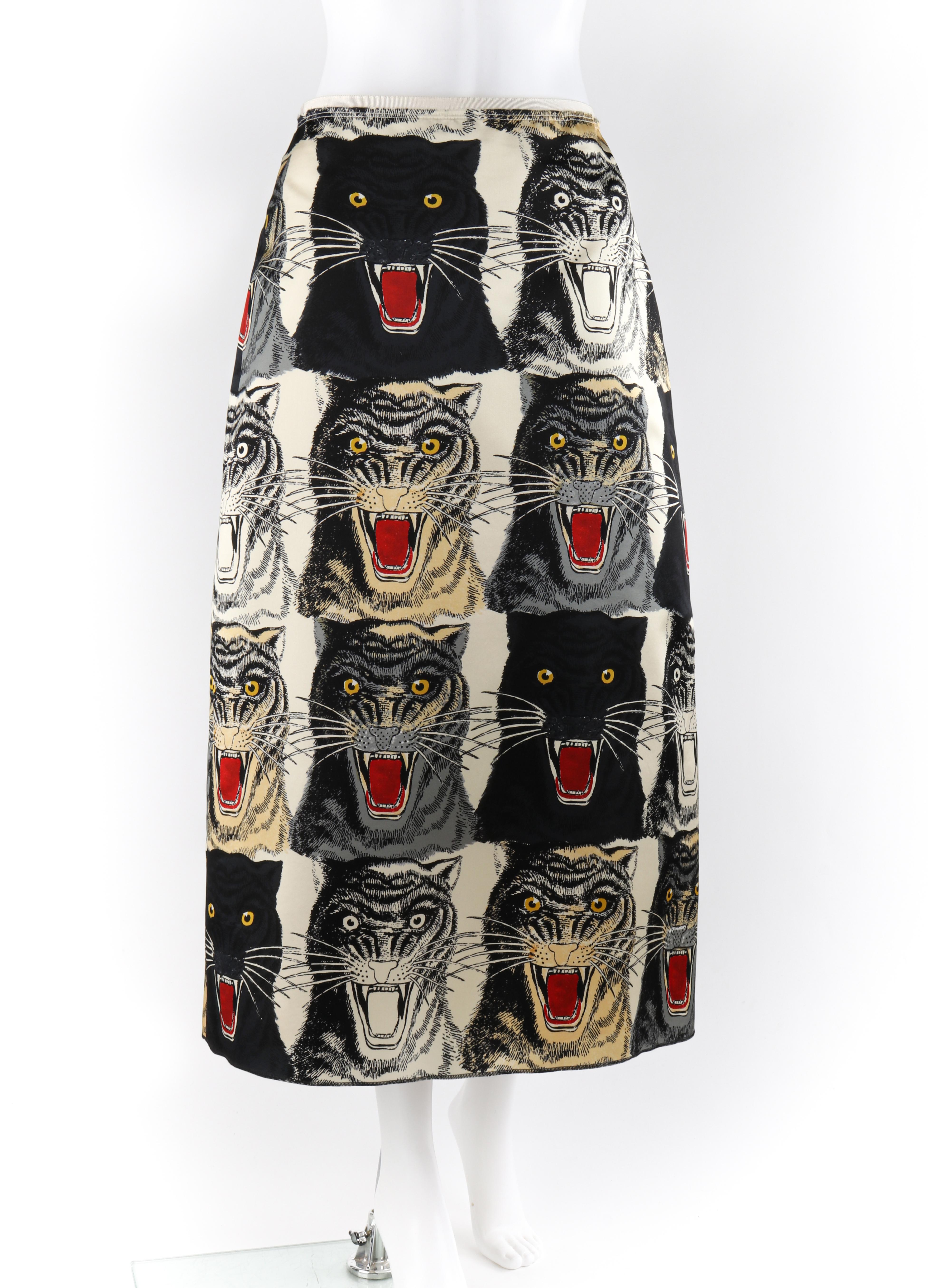 GUCCI Cream & Black Tiger Face Silk High Waist A-Line Midi Skirt NWT (New with Tags)
 
Estimated Retail: $1980.00
 
Brand / Manufacturer: Gucci
Designer: Alessandro Michele
Style: A-line midi skirt
Color(s): Shades of black, gray, cream, red, and