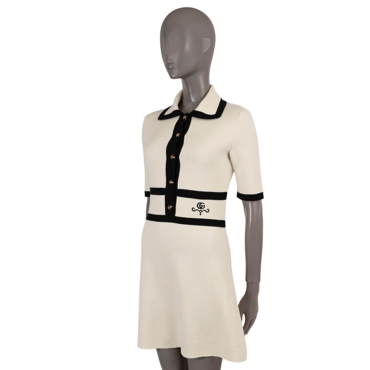 100% authentic Gucci GG piquet jacquard polo dress in cream wool (100% - please note the content tag is missing) with contrast black trim.  Features an A-line silhouette with short sleeves, polo collar and GG embroidered at the waist. Opens with